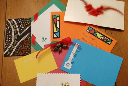 colorful cards made from paper, feathers, wire