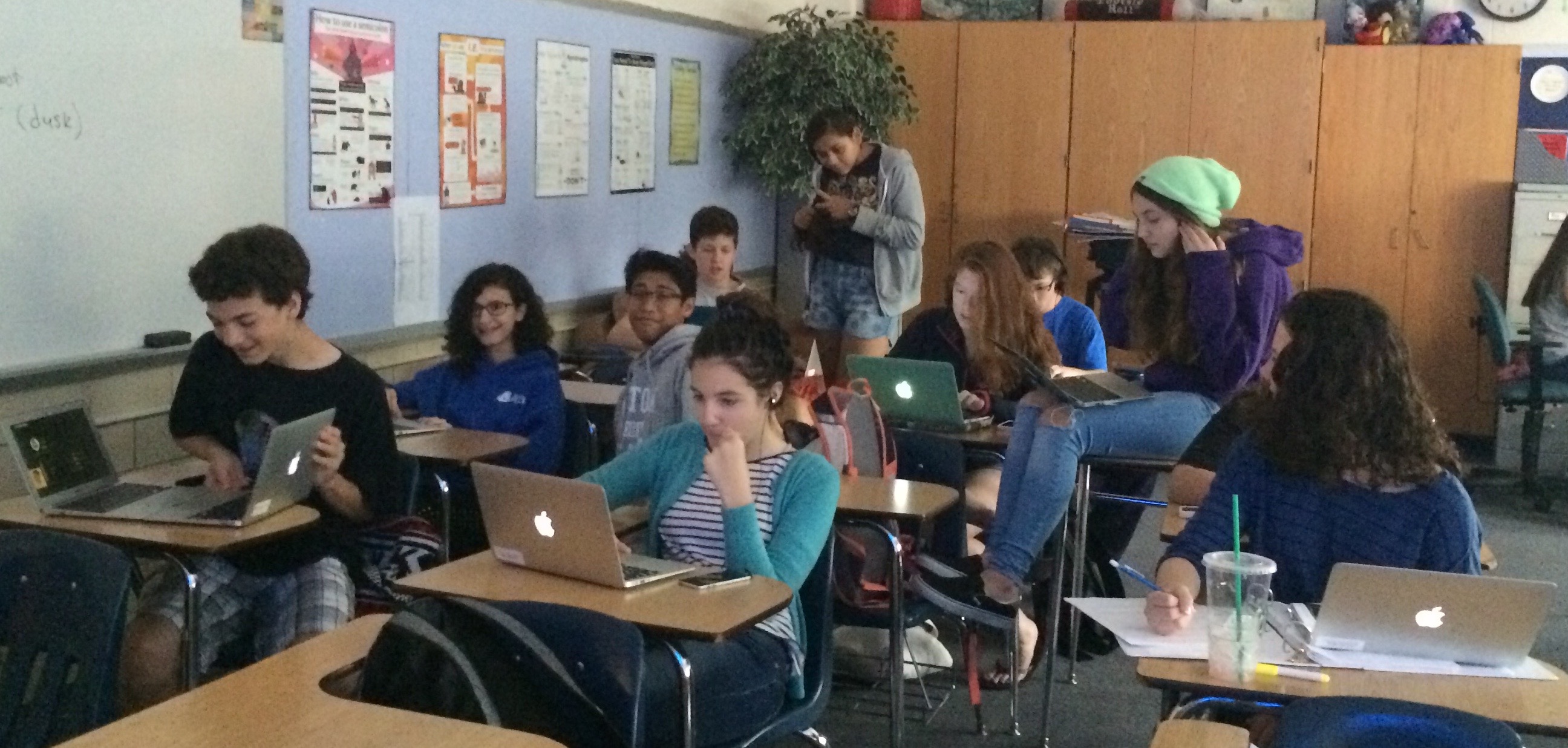 students using MacBook Airs in classroom