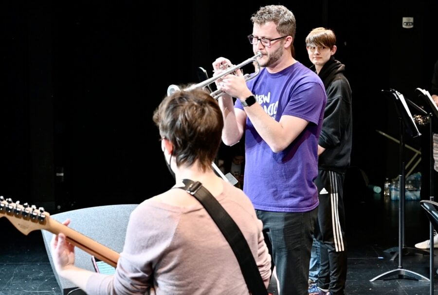 Teacher playing the trumpet