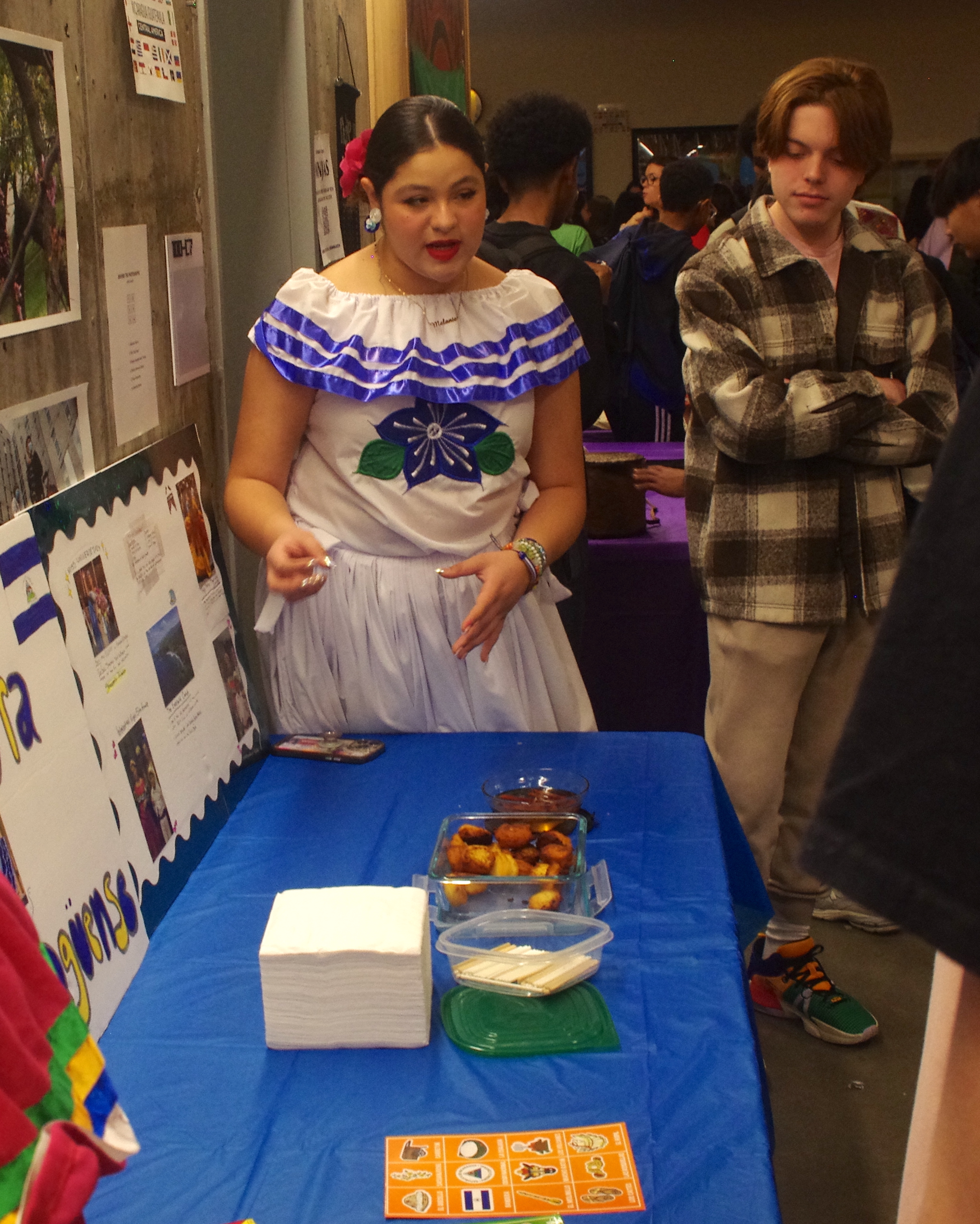 Student talking with others about her culture