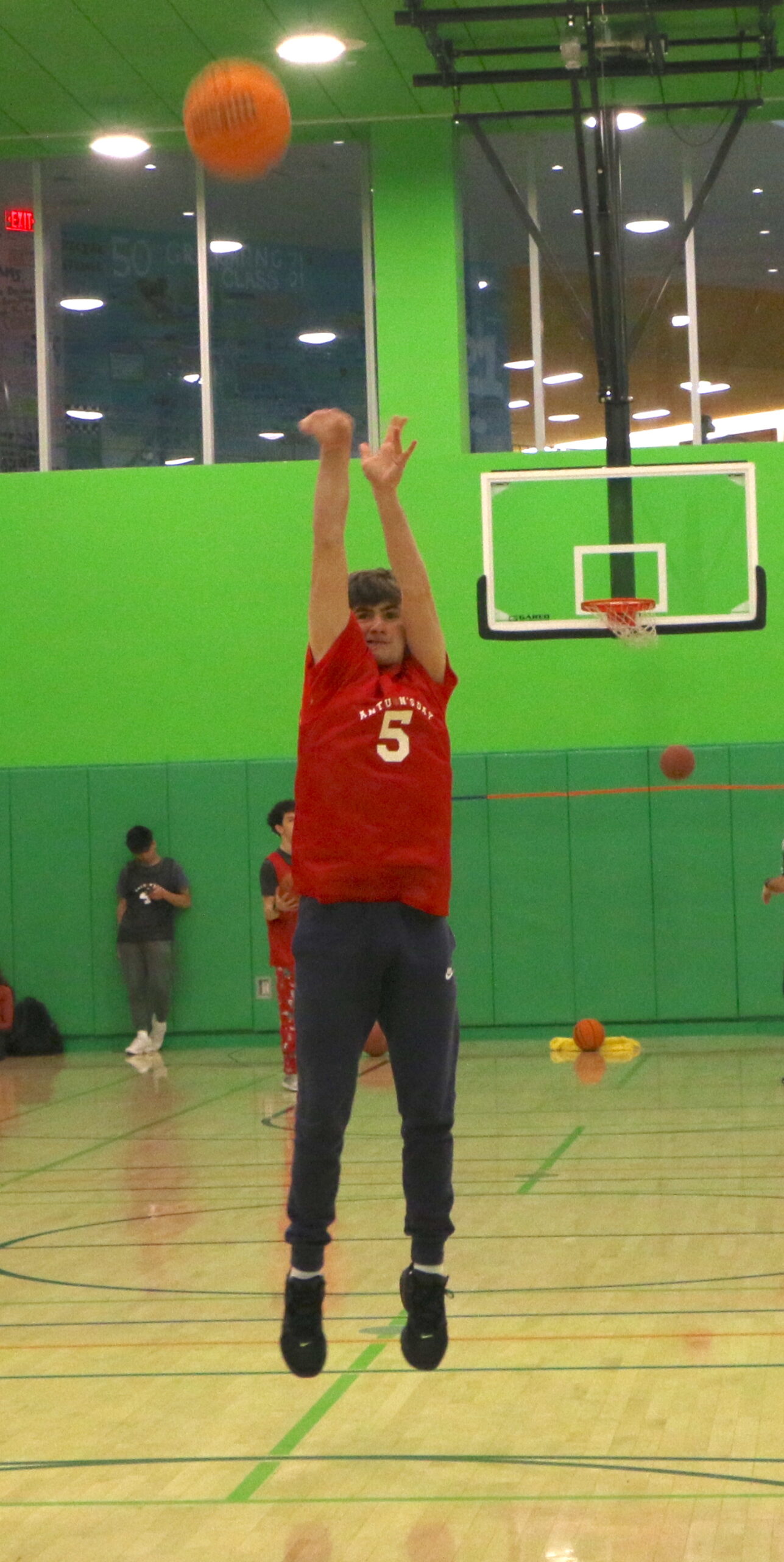Student shooting a basketball
