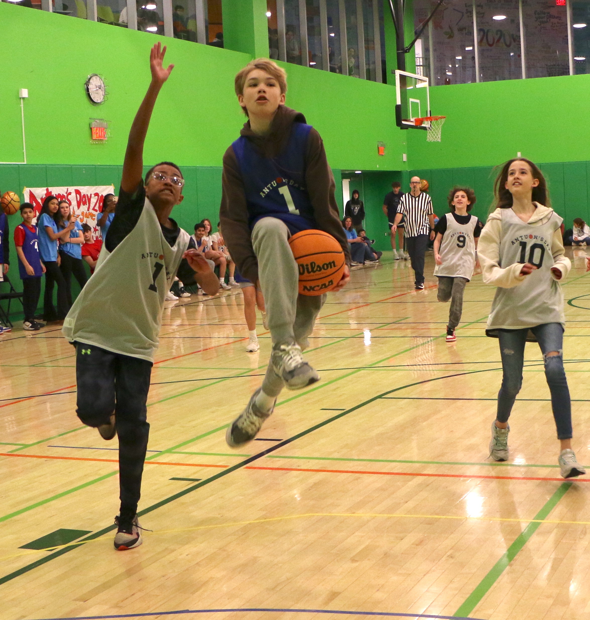 Students playing a basketball game