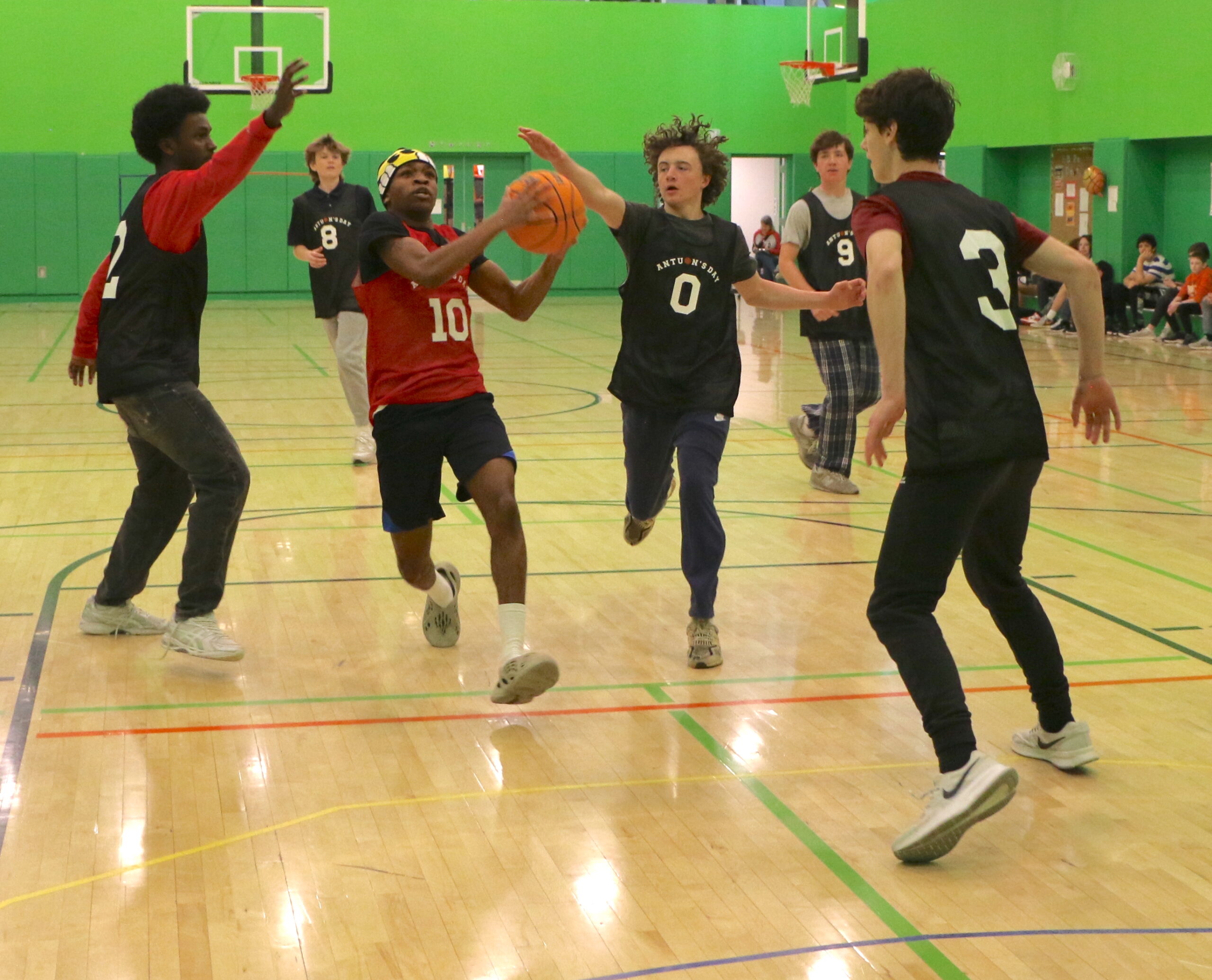 Students playing a basketball game