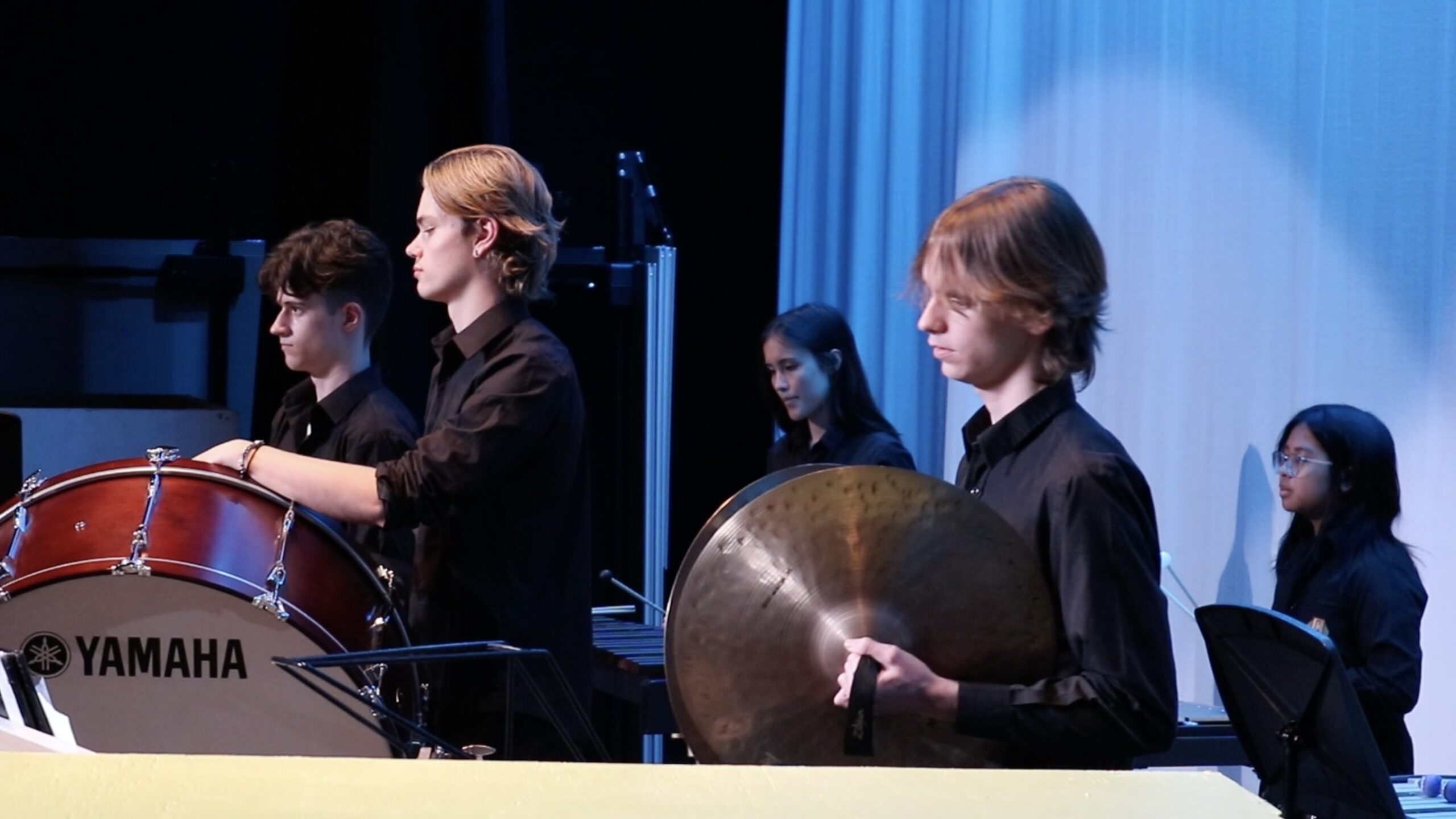 Two students playing percussion
