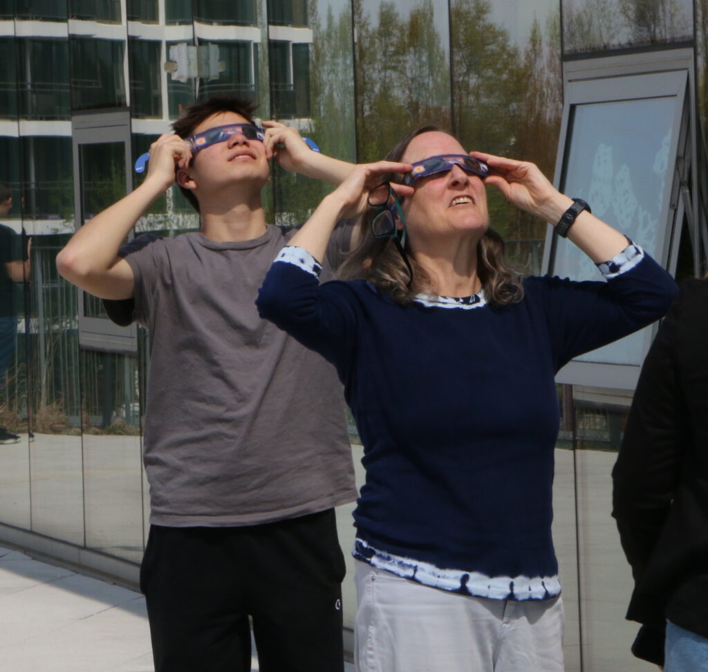 Two people viewing the elcipse