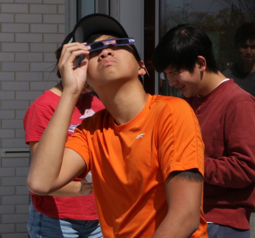 Student viewing eclipse