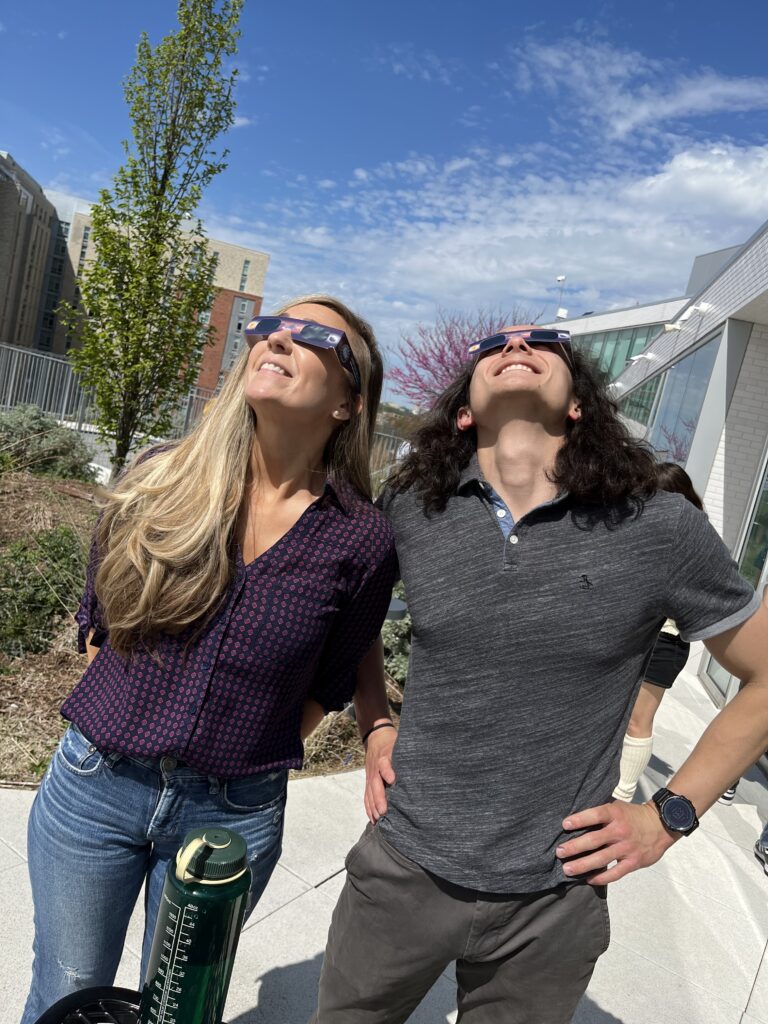 Two teachers viewing eclipse