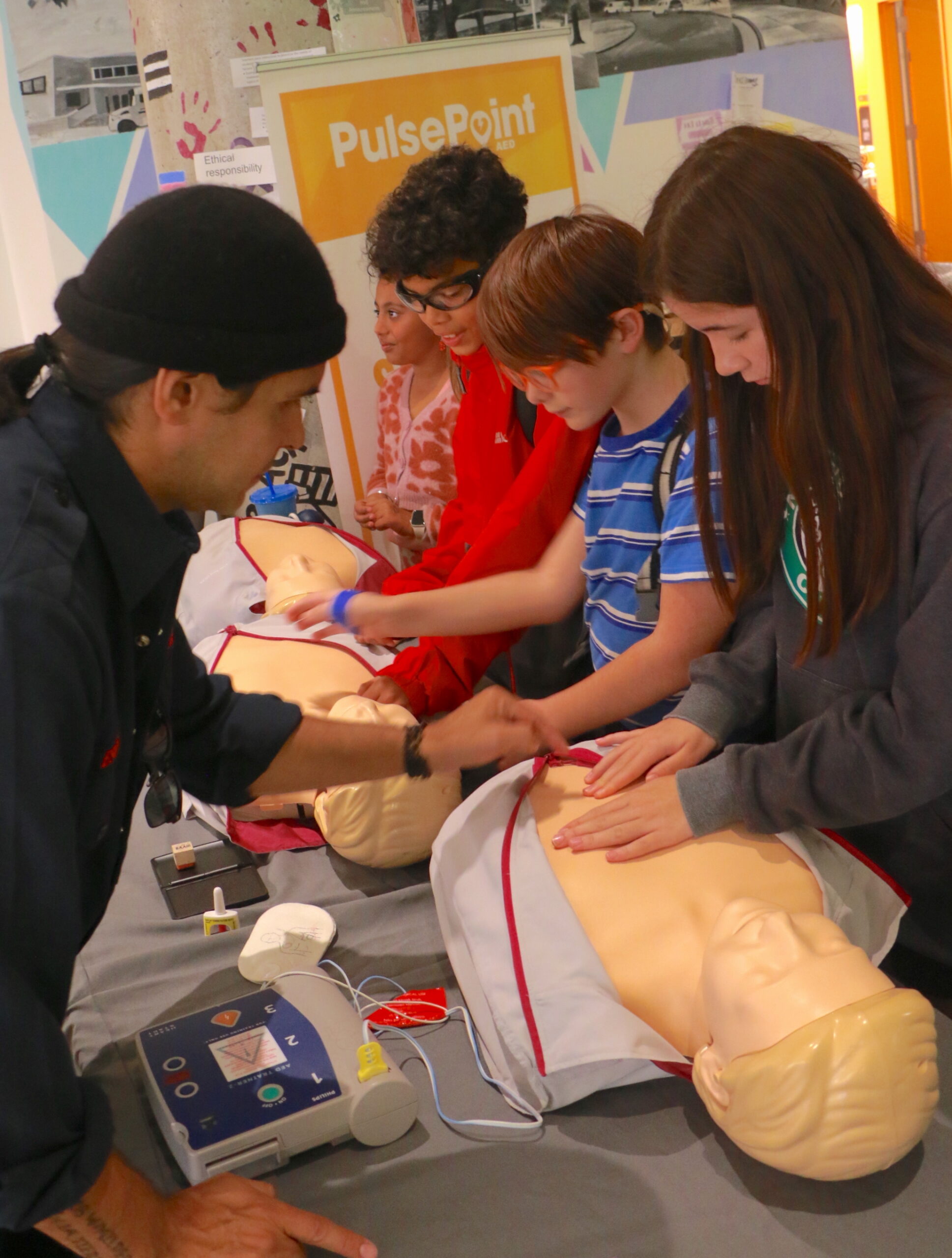 Students watching a CPR demonstration