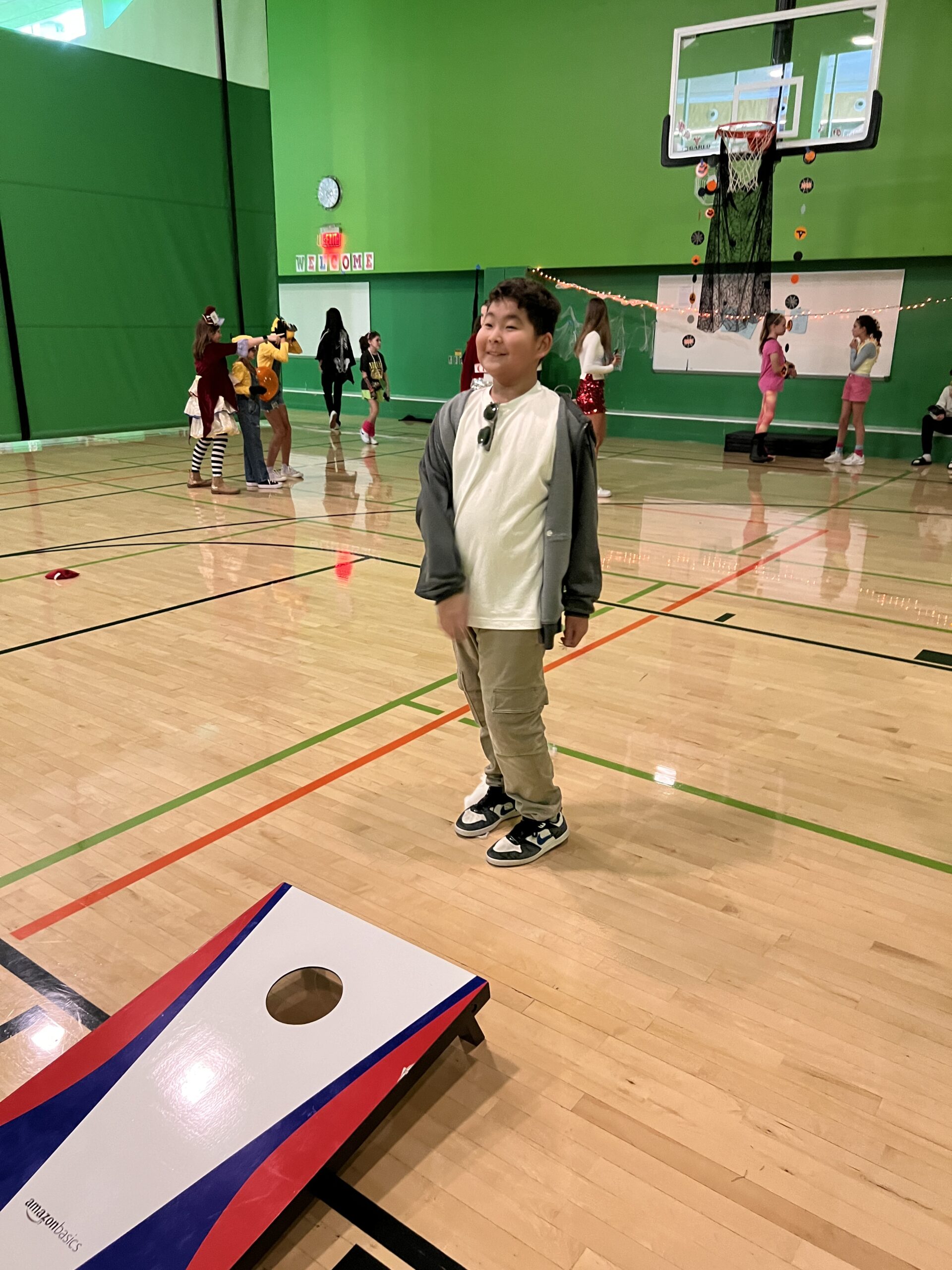 Middle schooler playing a game in the gym