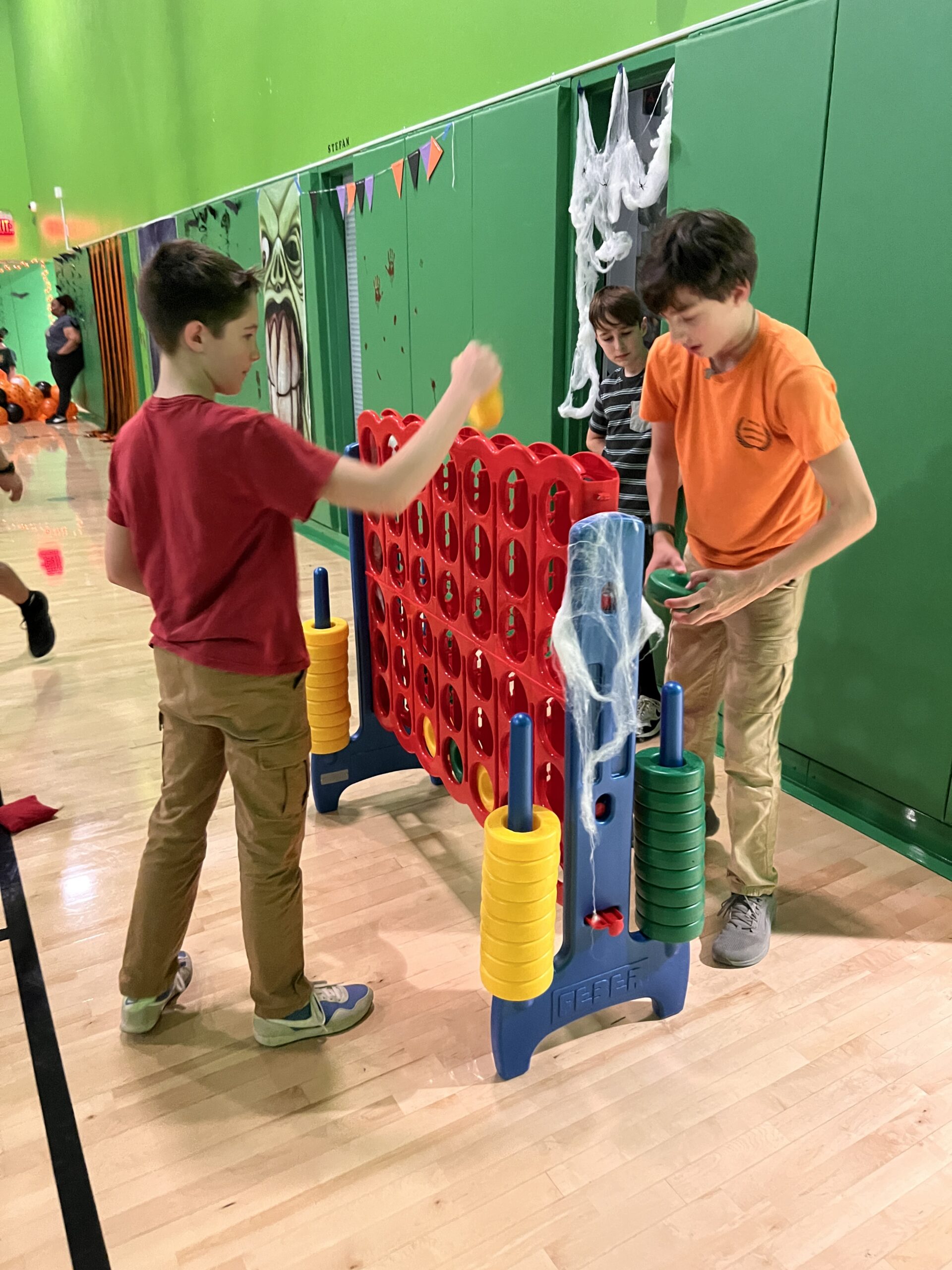 Middle schoolers playing games in the gym