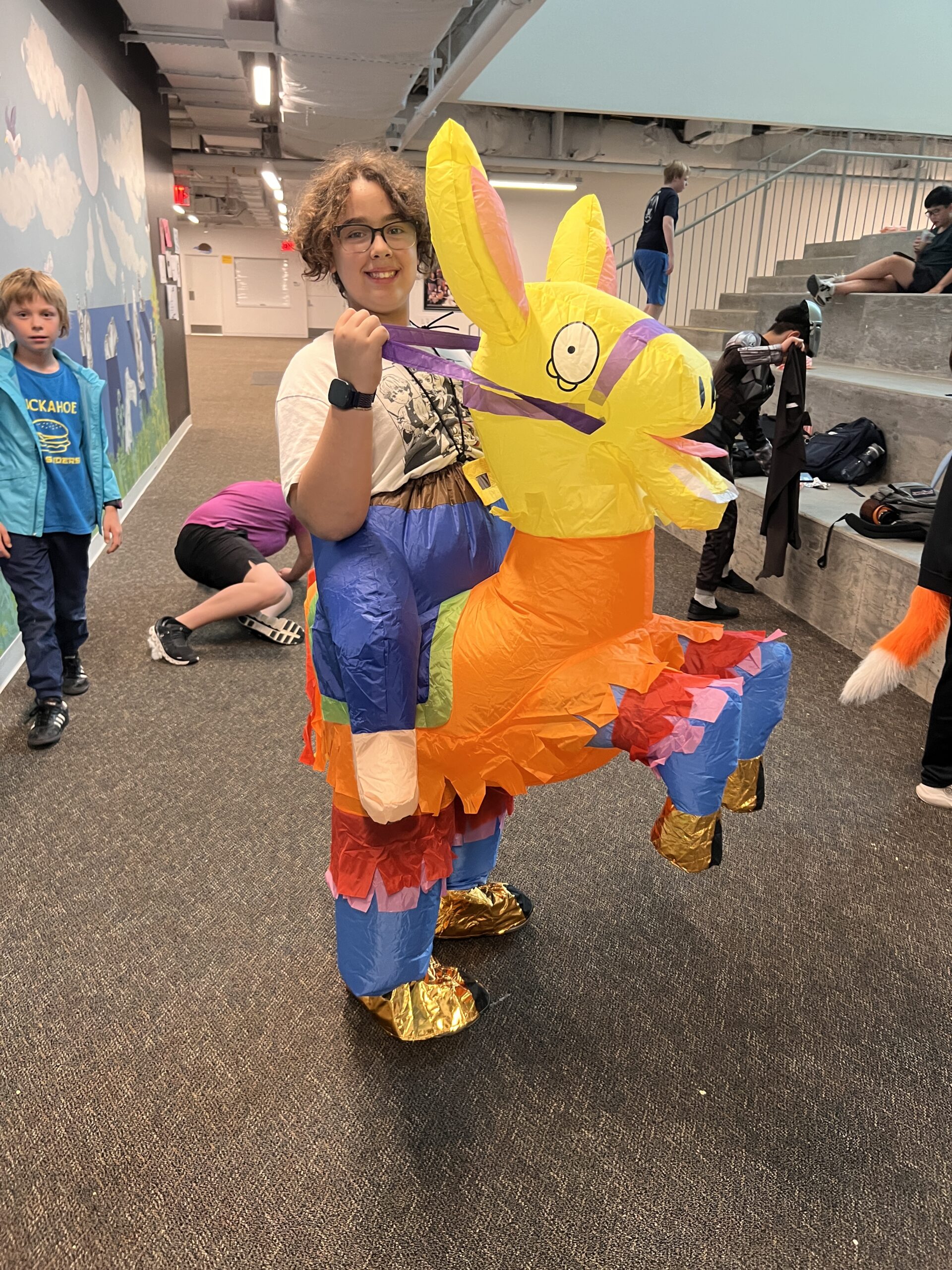 Boy riding a donkey pinata