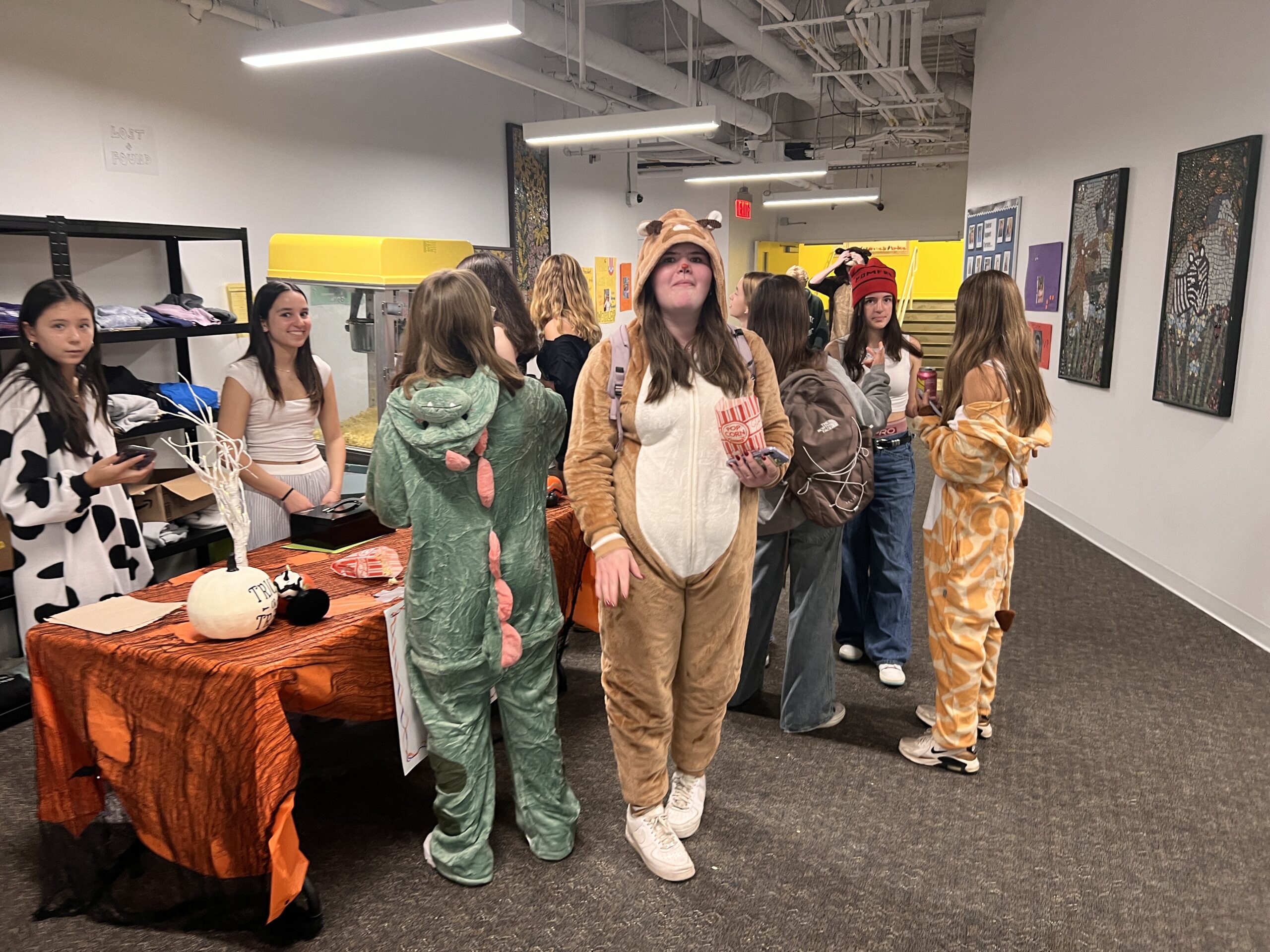 Group in costume getting popcorn