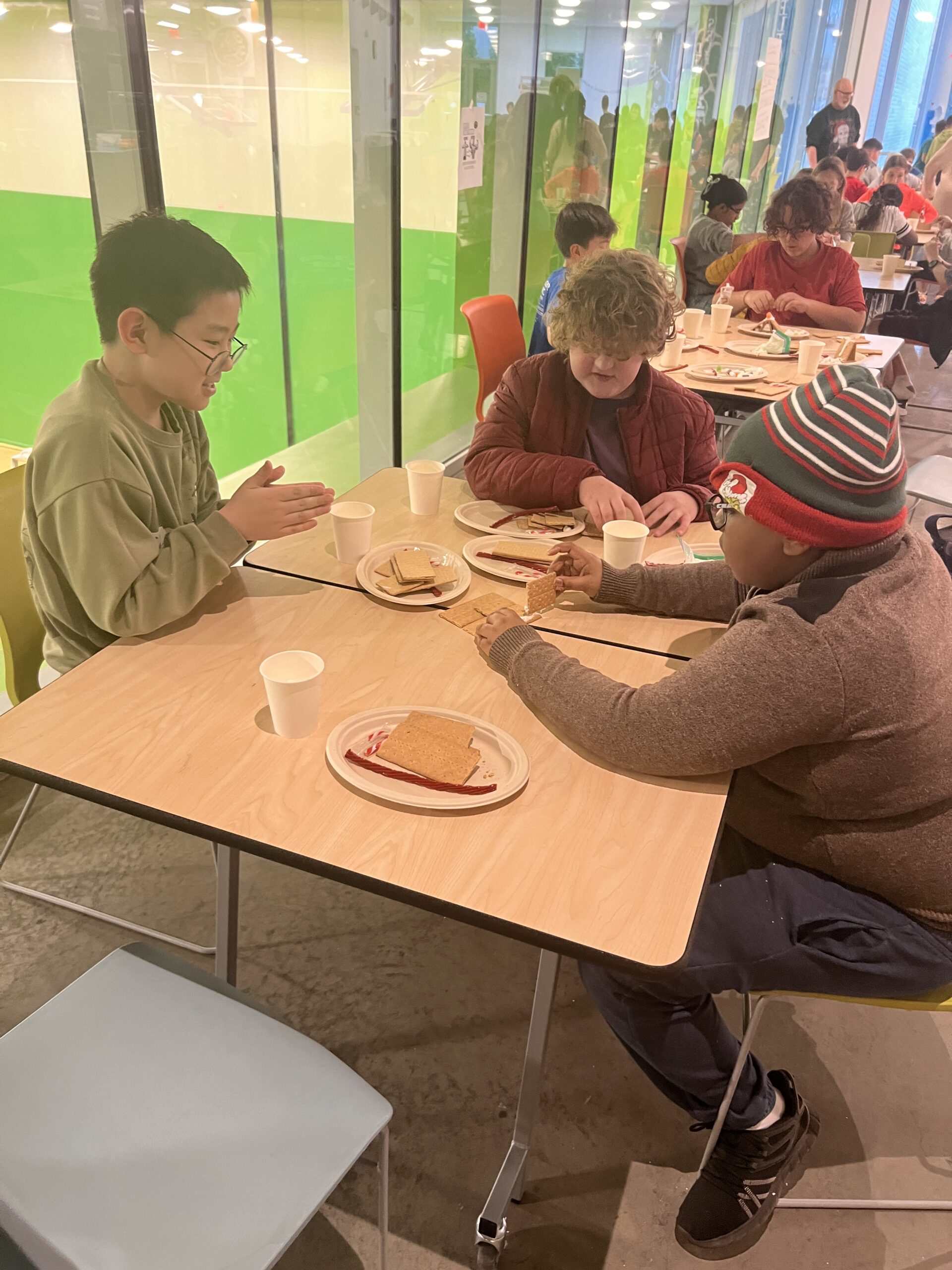 Students making gingerbread houses