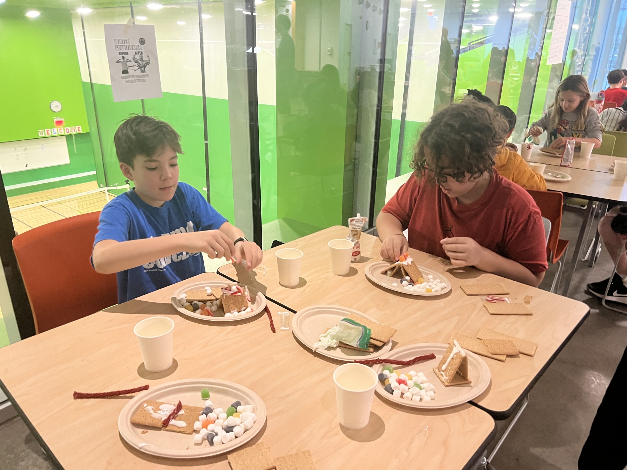 Students making gingerbread houses