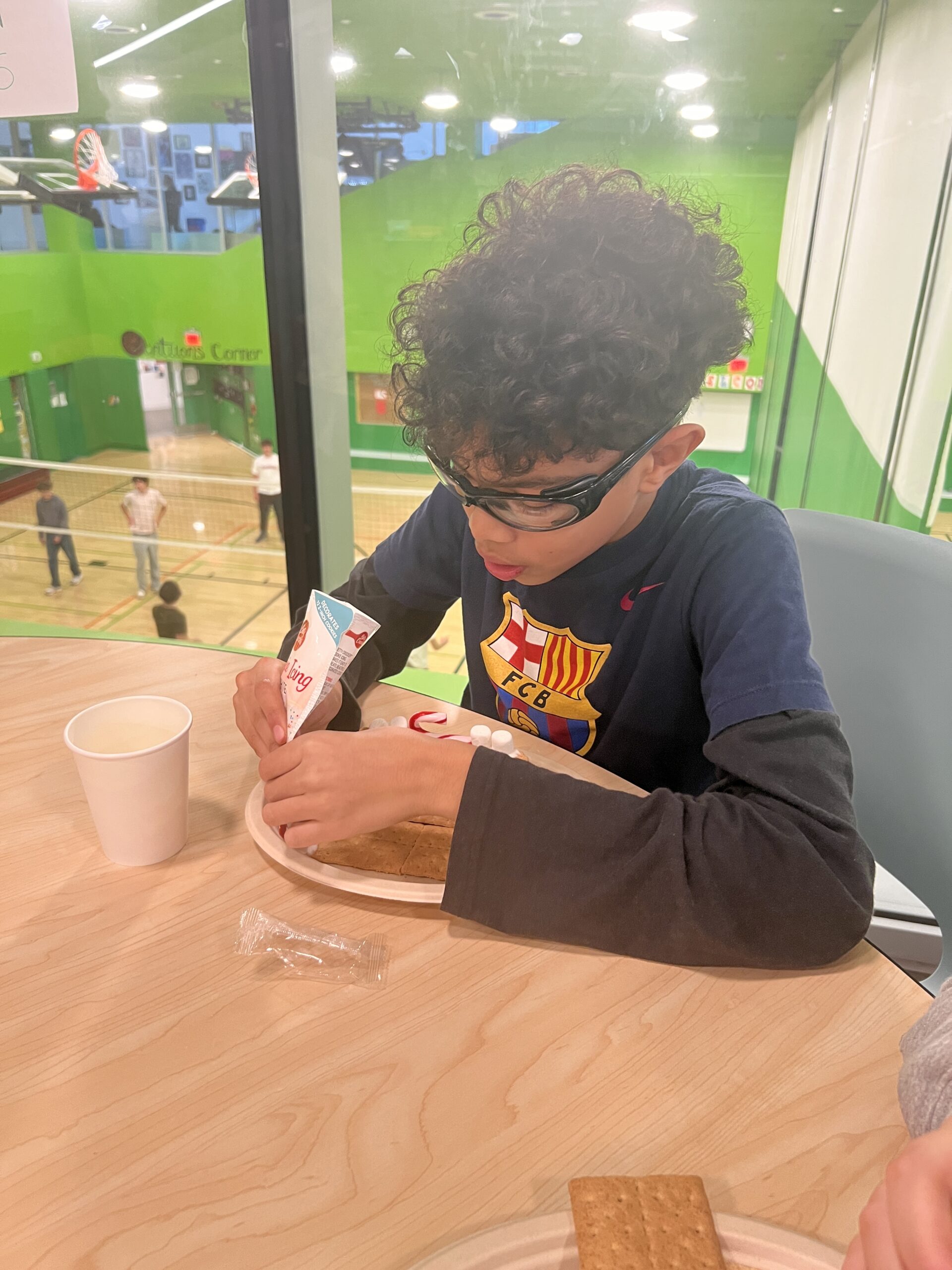 Students making gingerbread houses