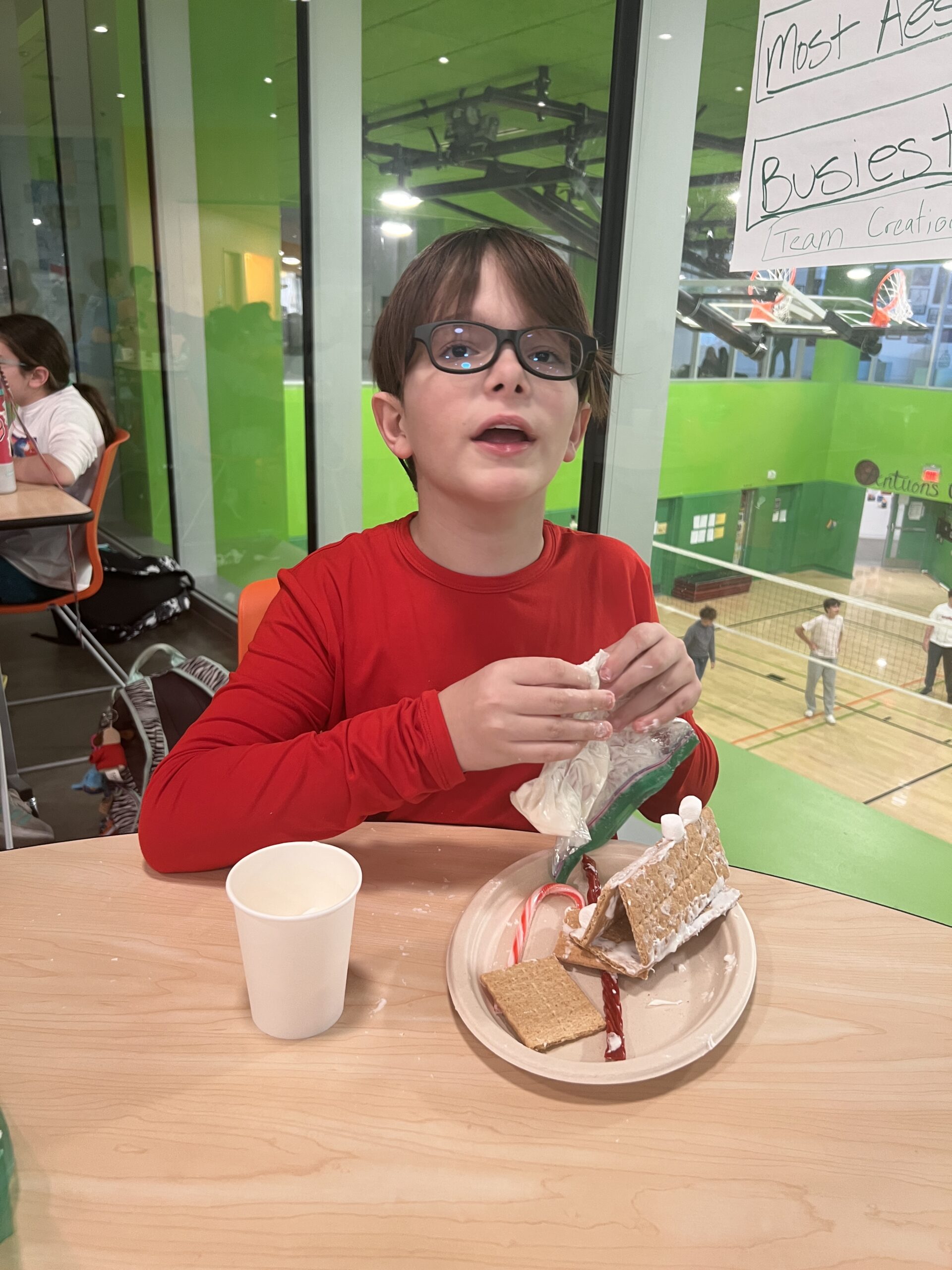 Students making gingerbread houses