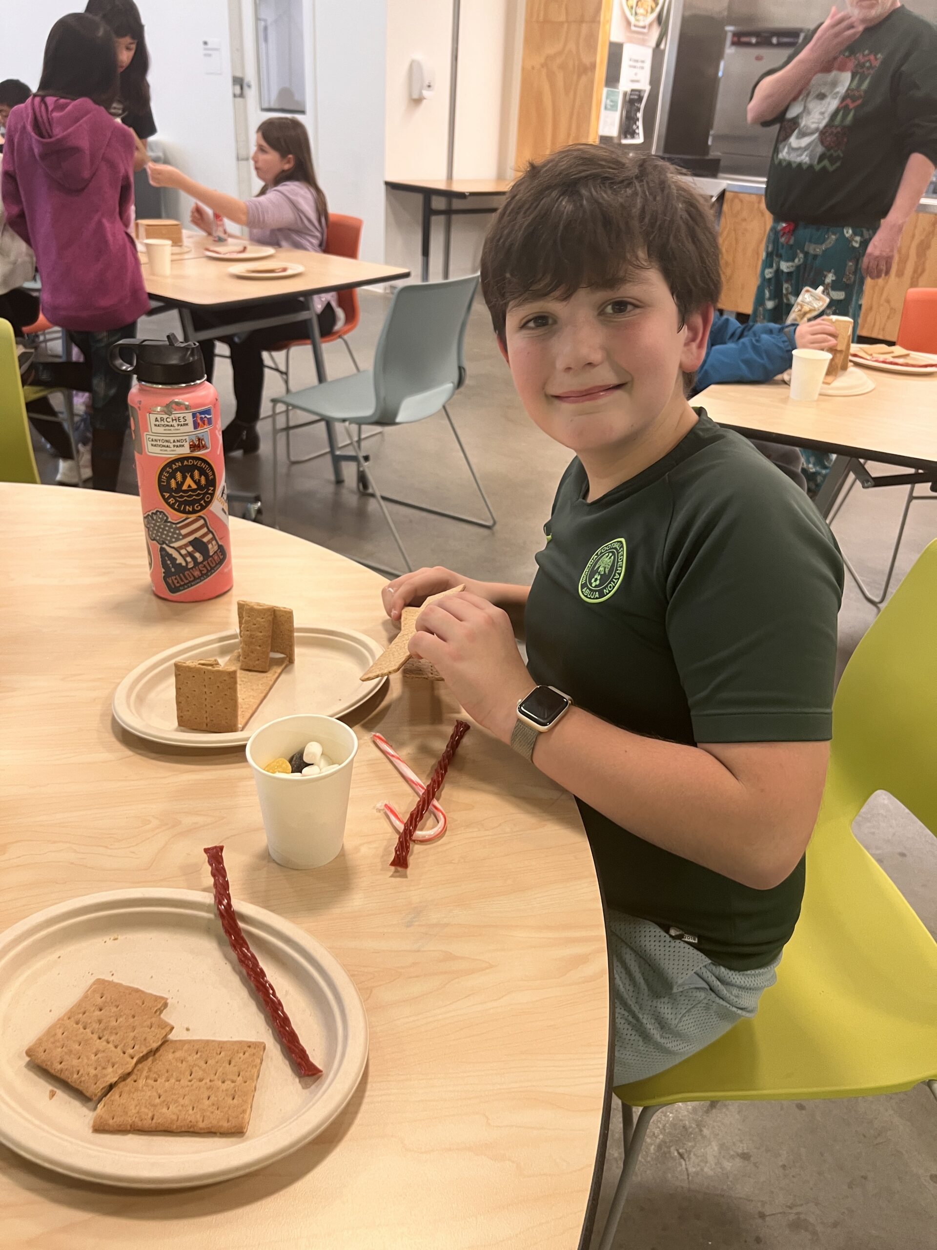 Students making gingerbread houses