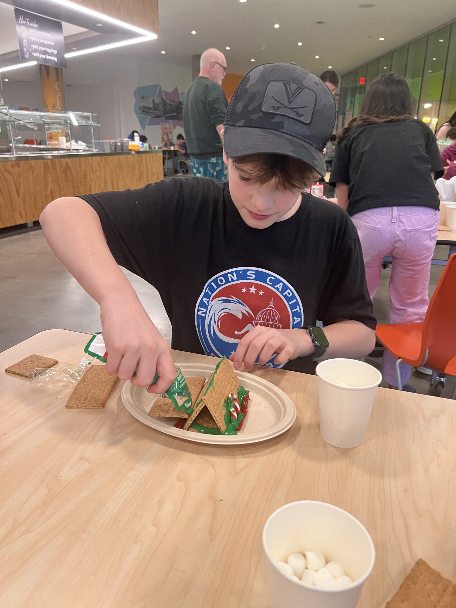 Students making gingerbread houses