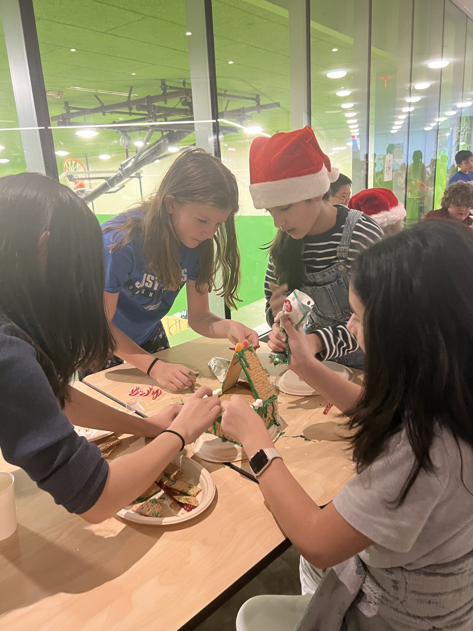 Students making gingerbread houses