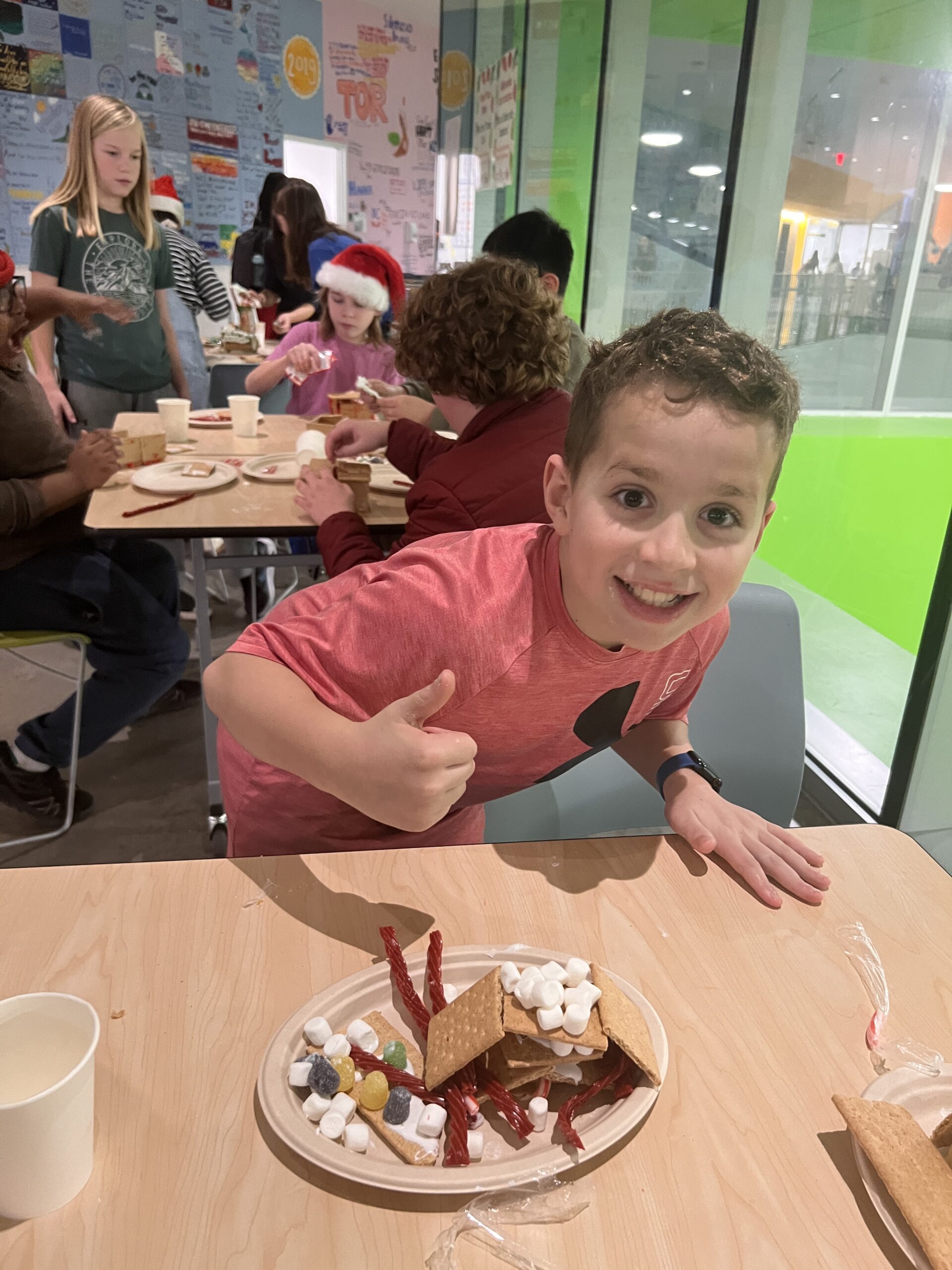 Students making gingerbread houses