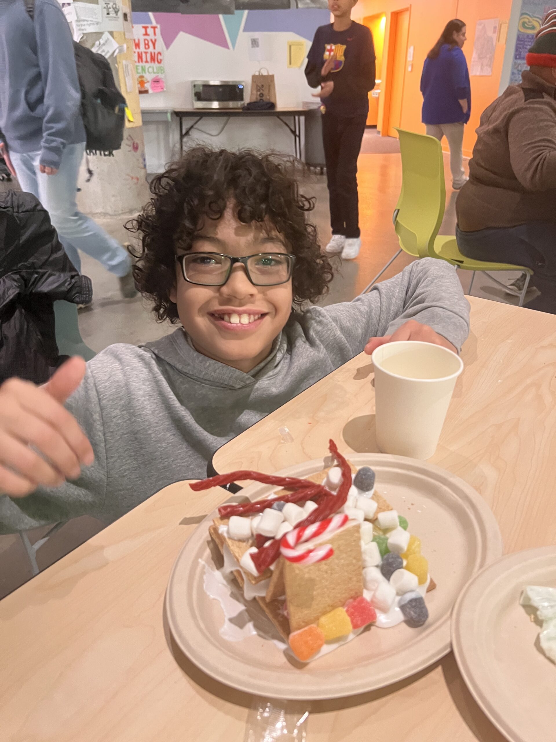 Students making gingerbread houses