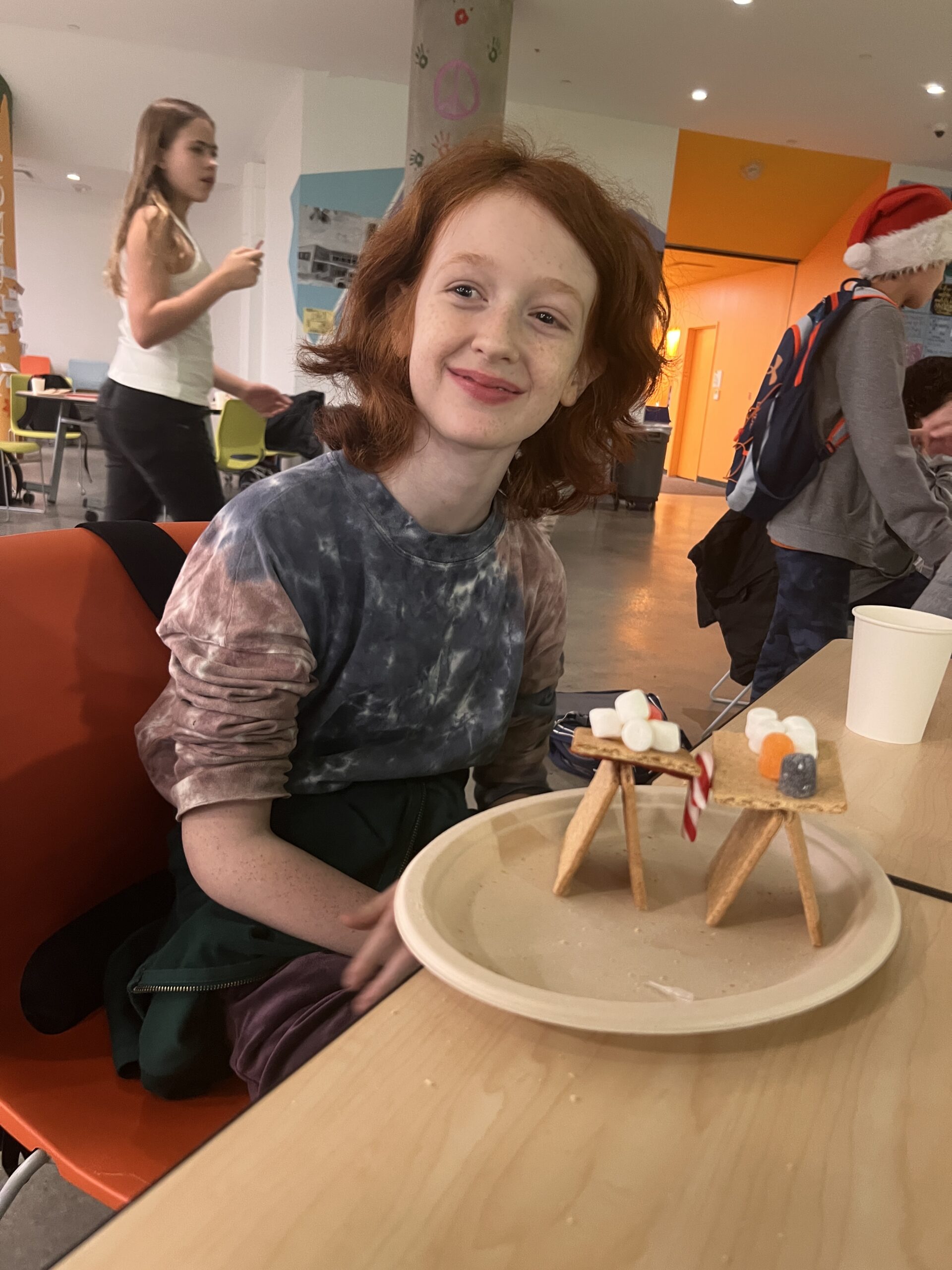 Students making gingerbread houses