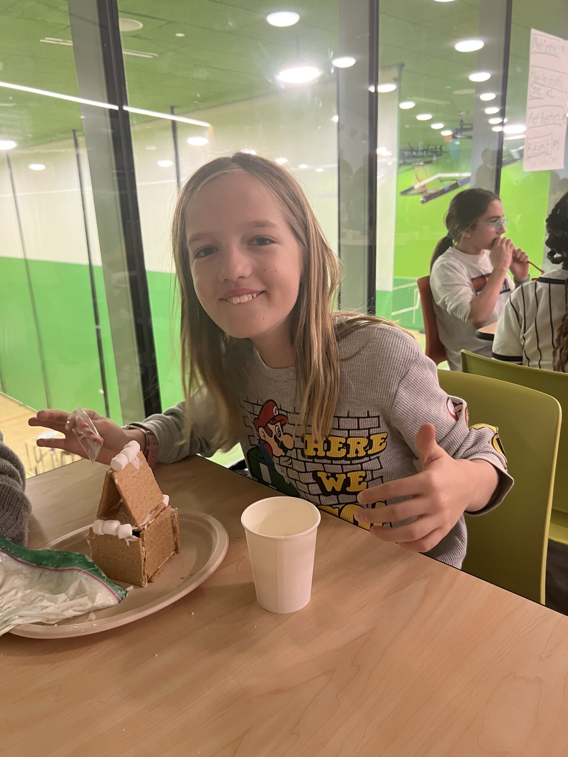 Students making gingerbread houses