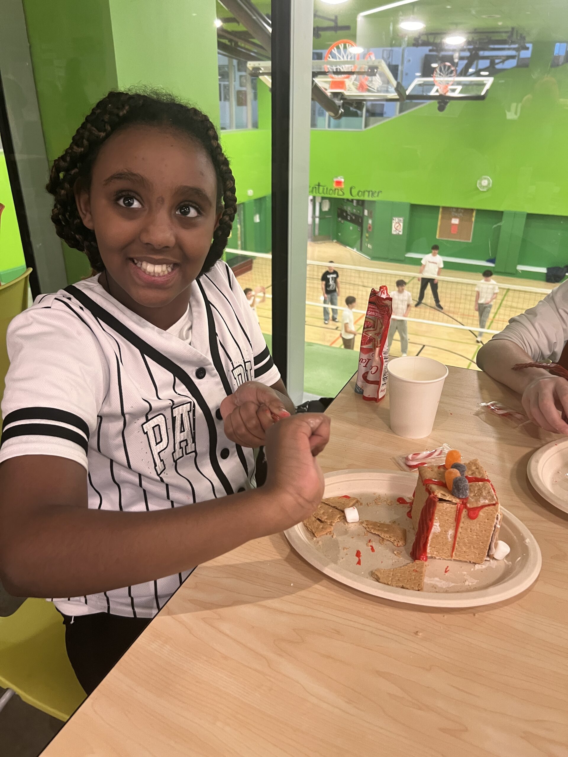 Students making gingerbread houses