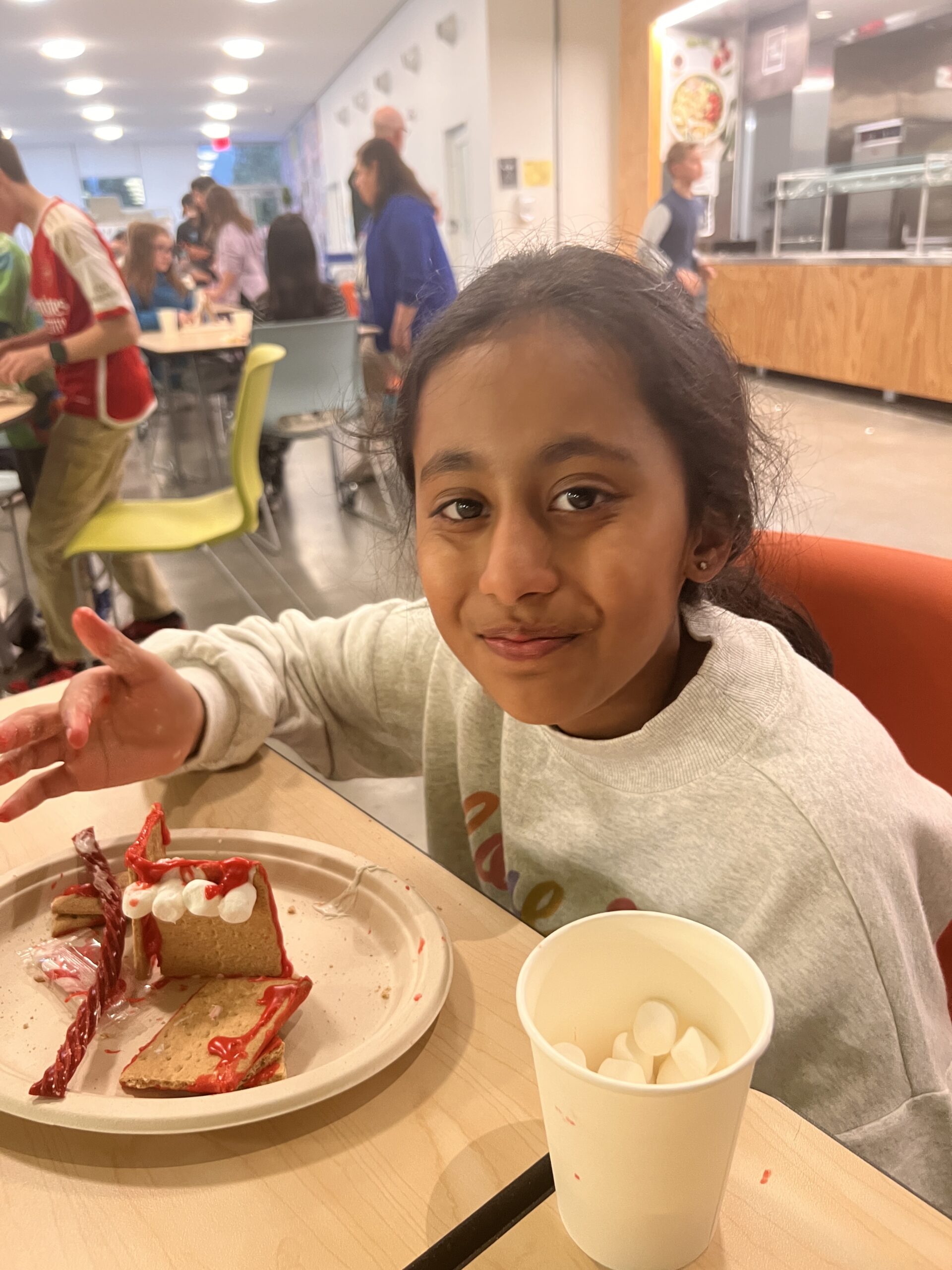 Students making gingerbread houses