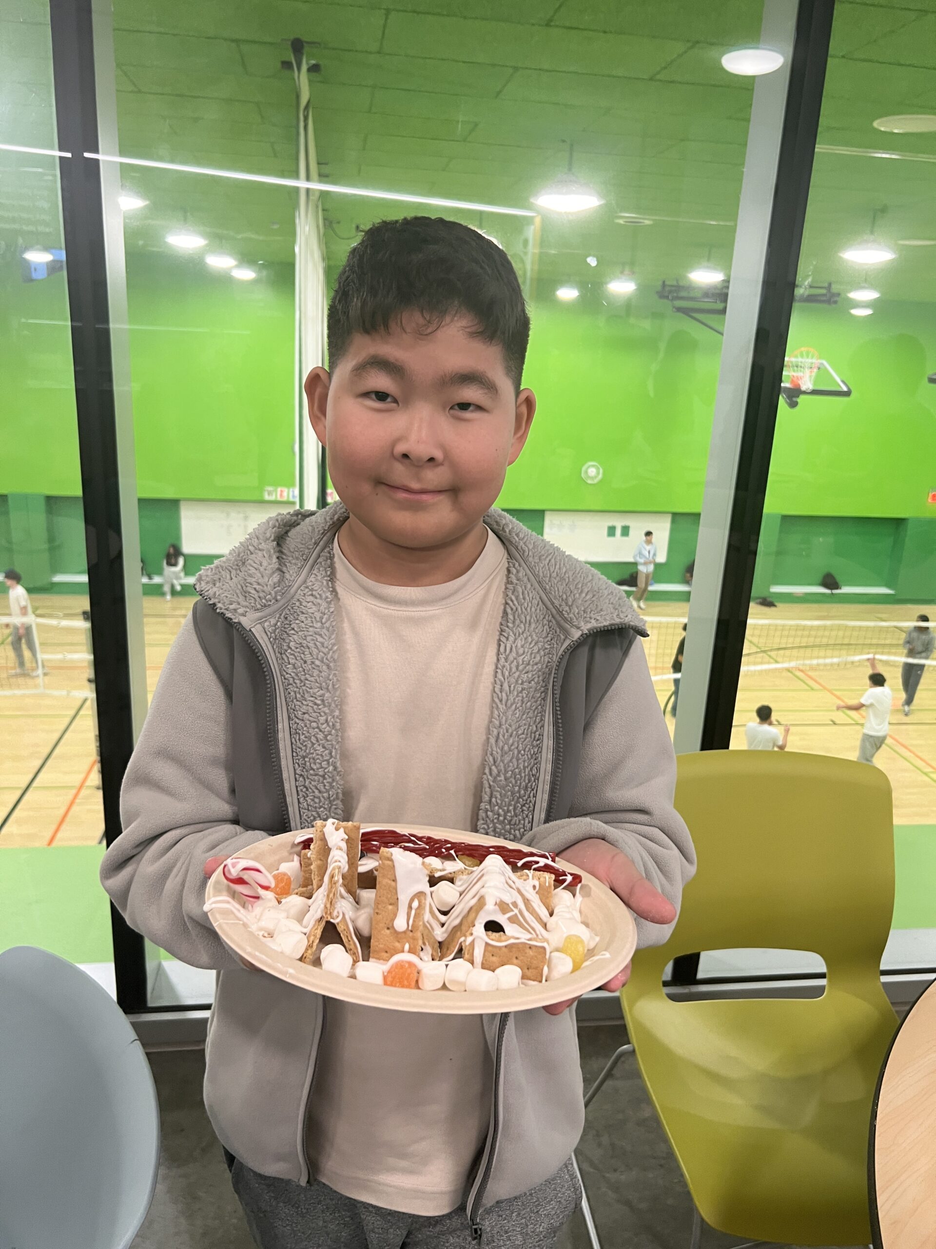 Students making gingerbread houses