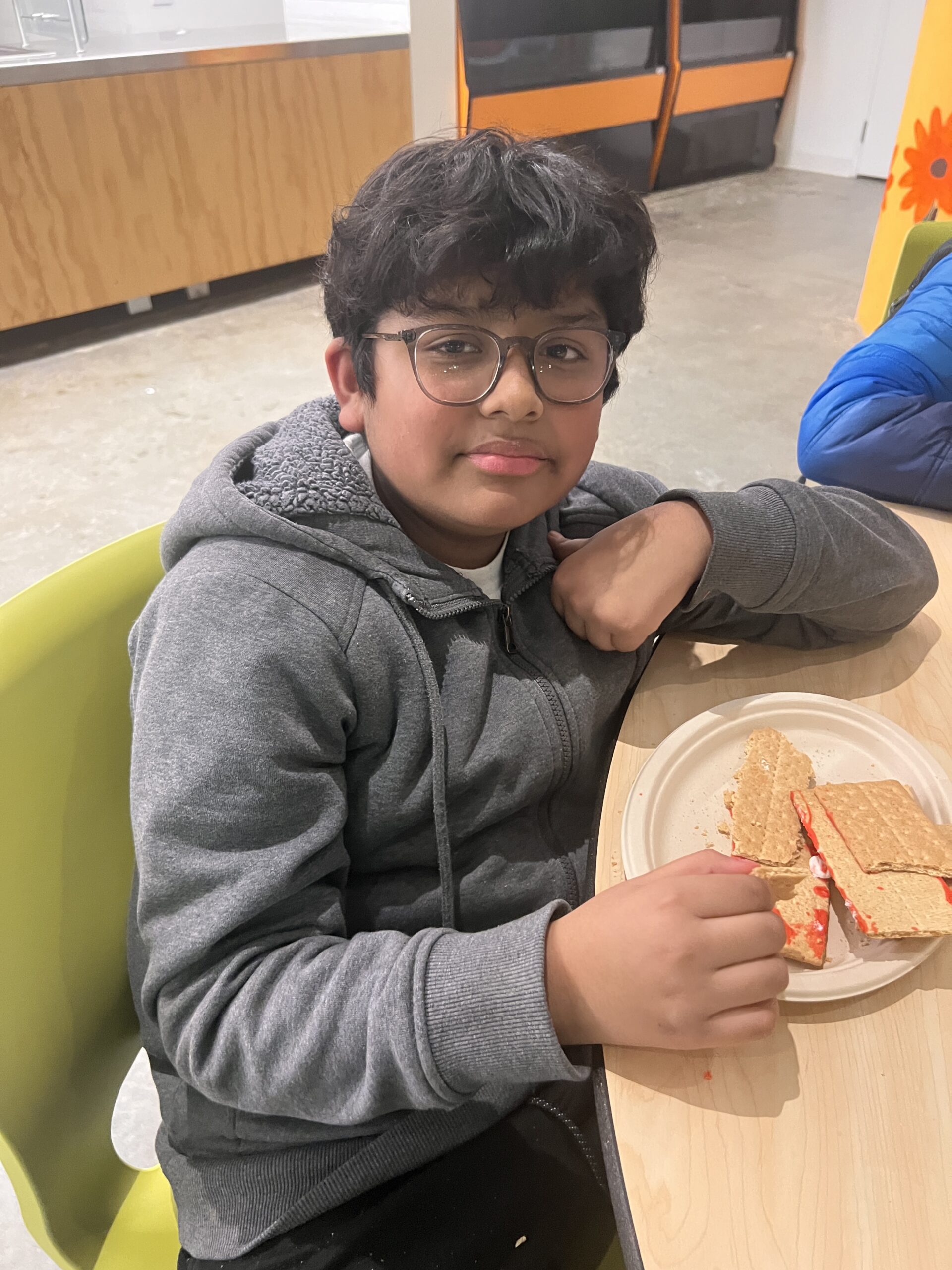 Students making gingerbread houses