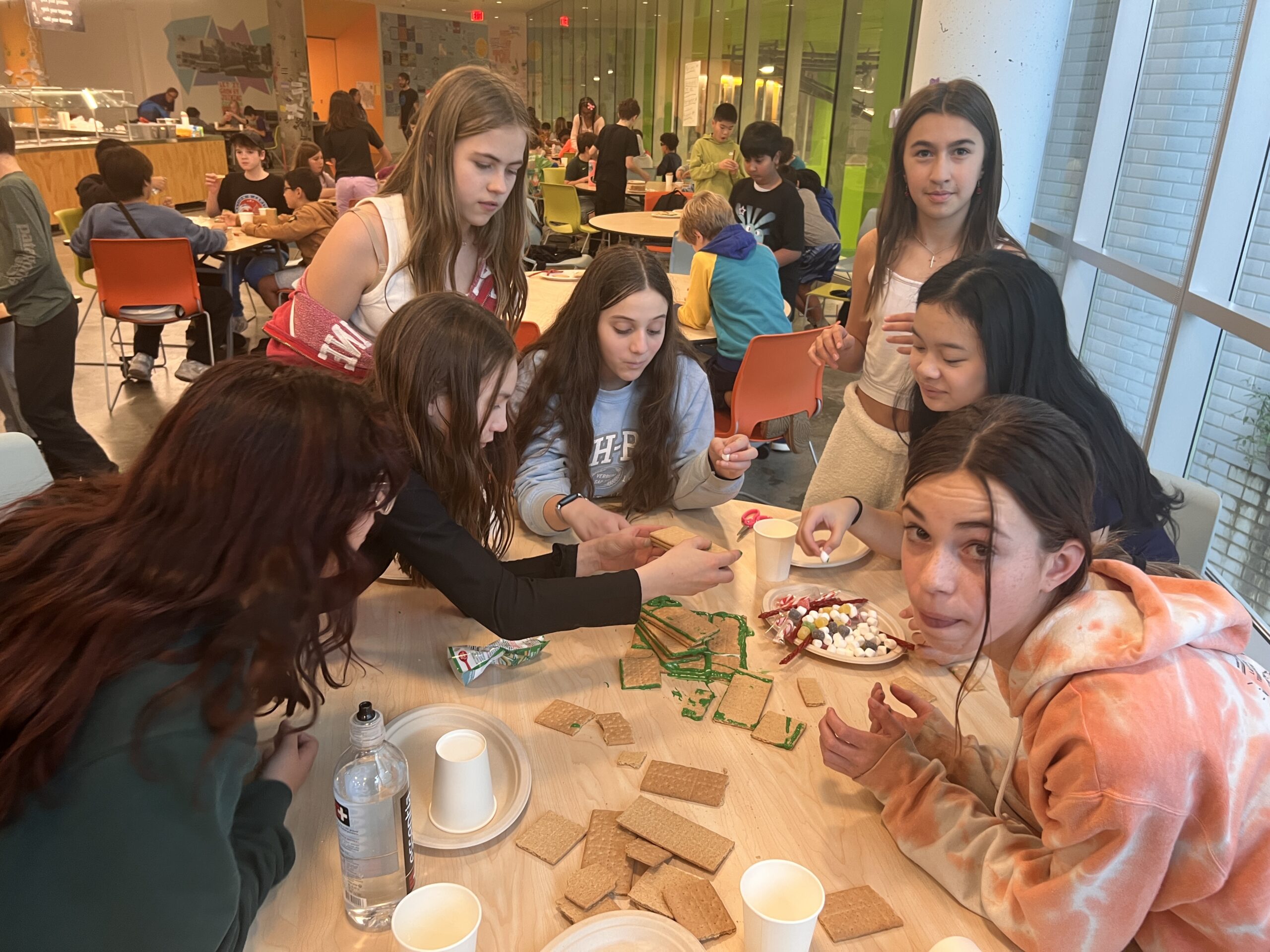 Students making gingerbread houses