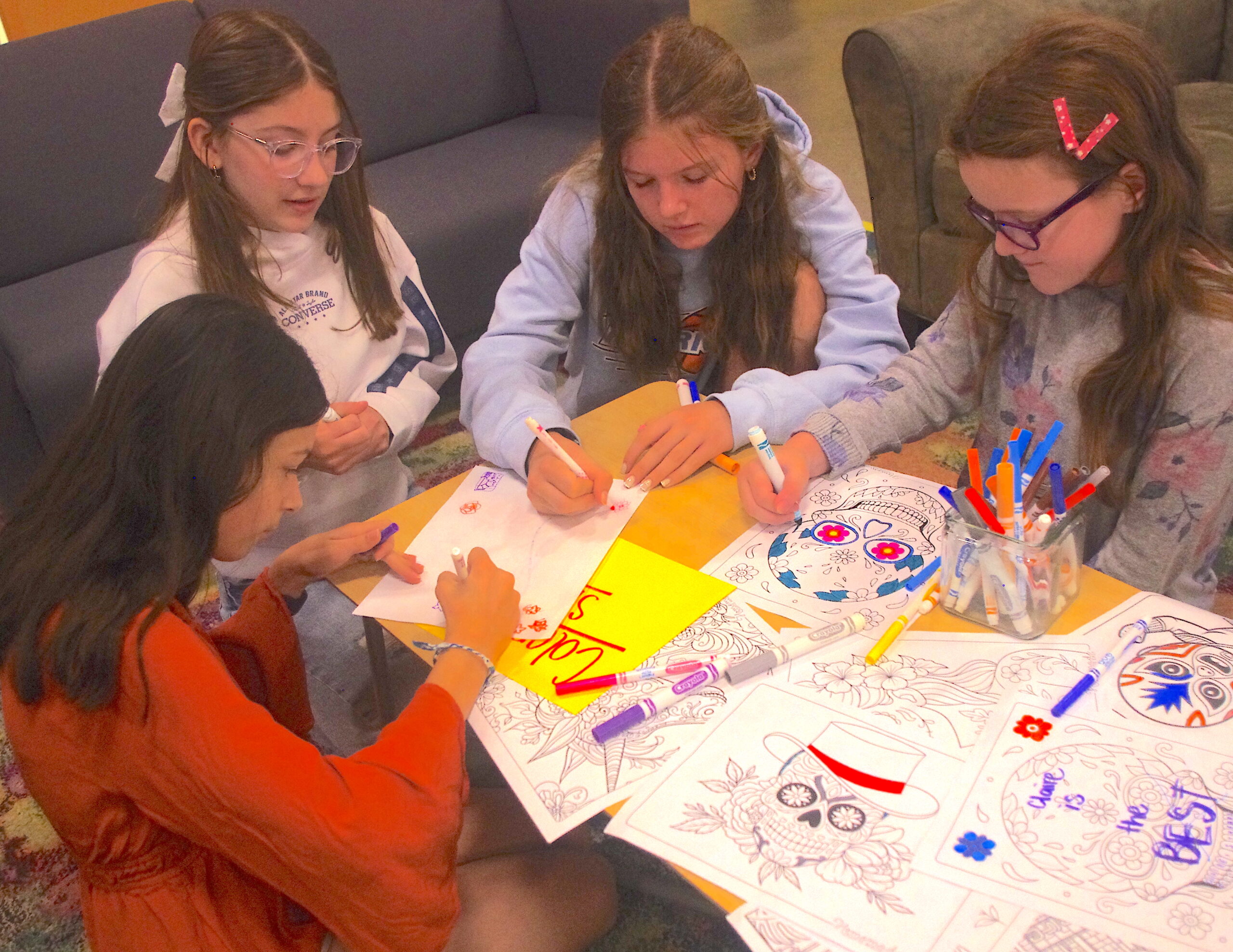 Students coloring at Hispanic Heritage Celebration