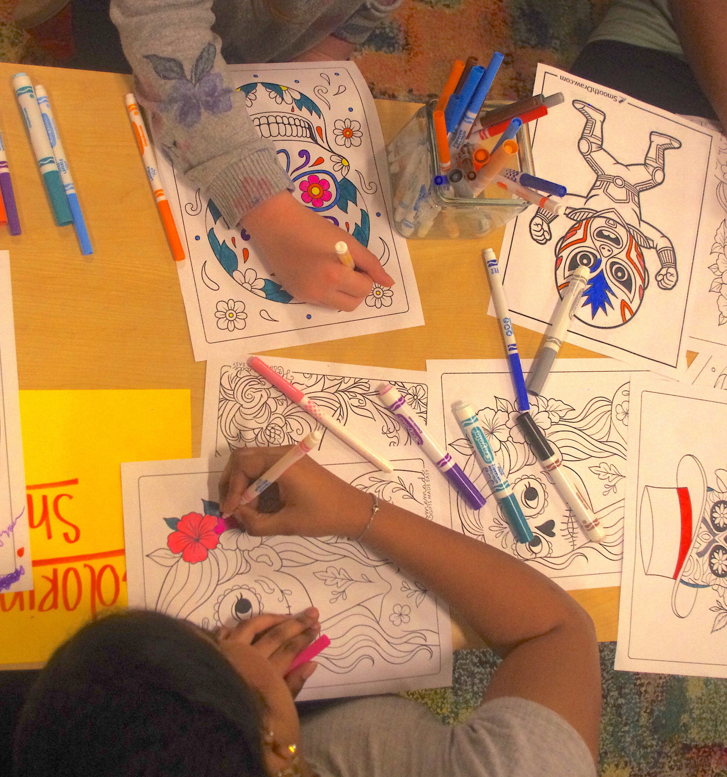 Students coloring at Hispanic Heritage Celebration