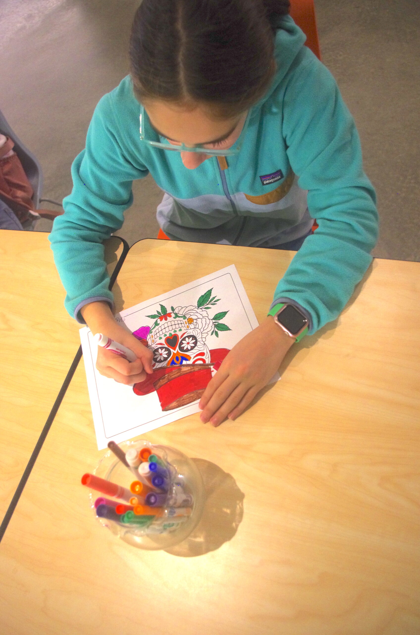 Student coloring at Hispanic Heritage Celebration