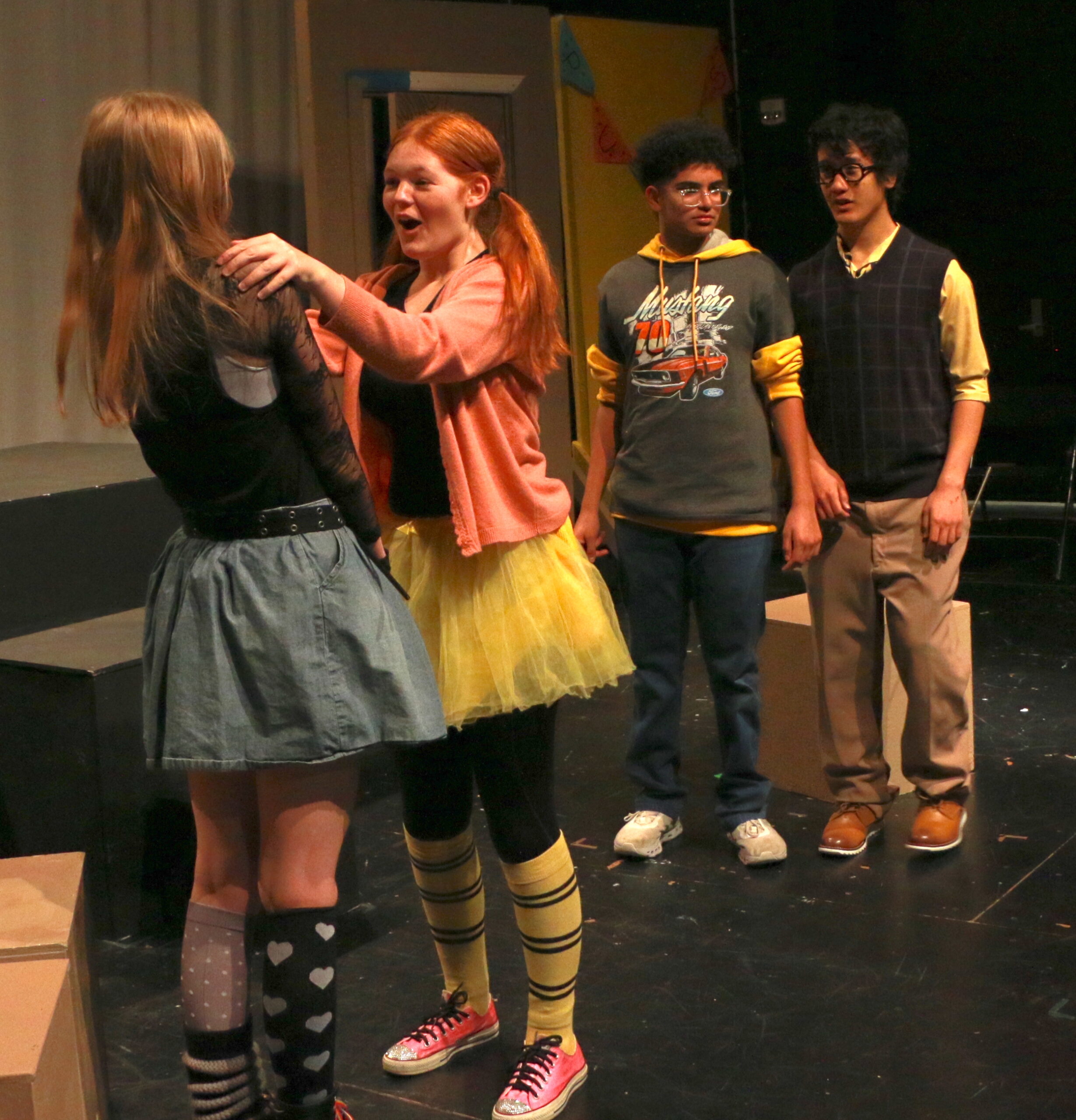 Student actors performing in Puffs
