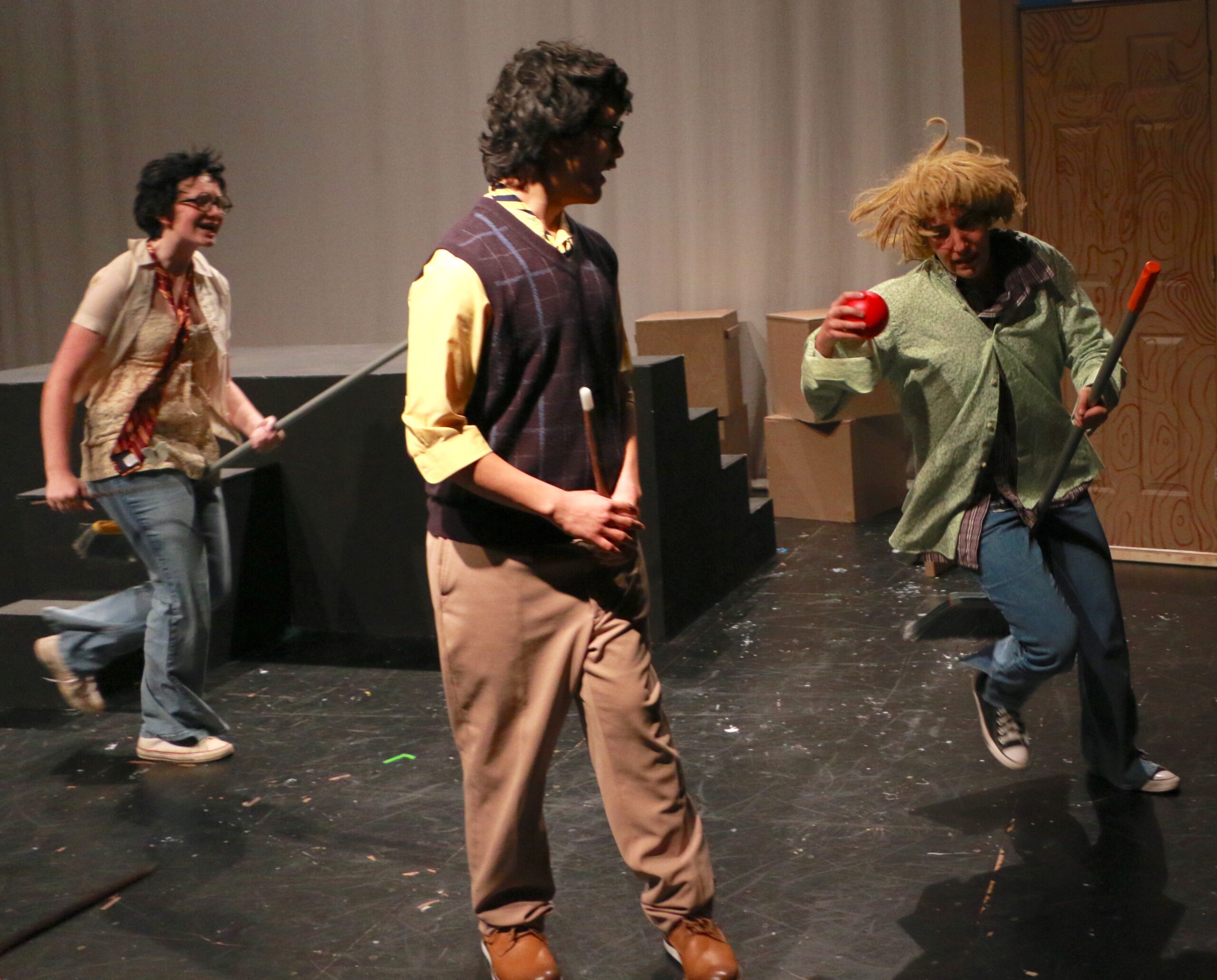 Student actors performing in Puffs