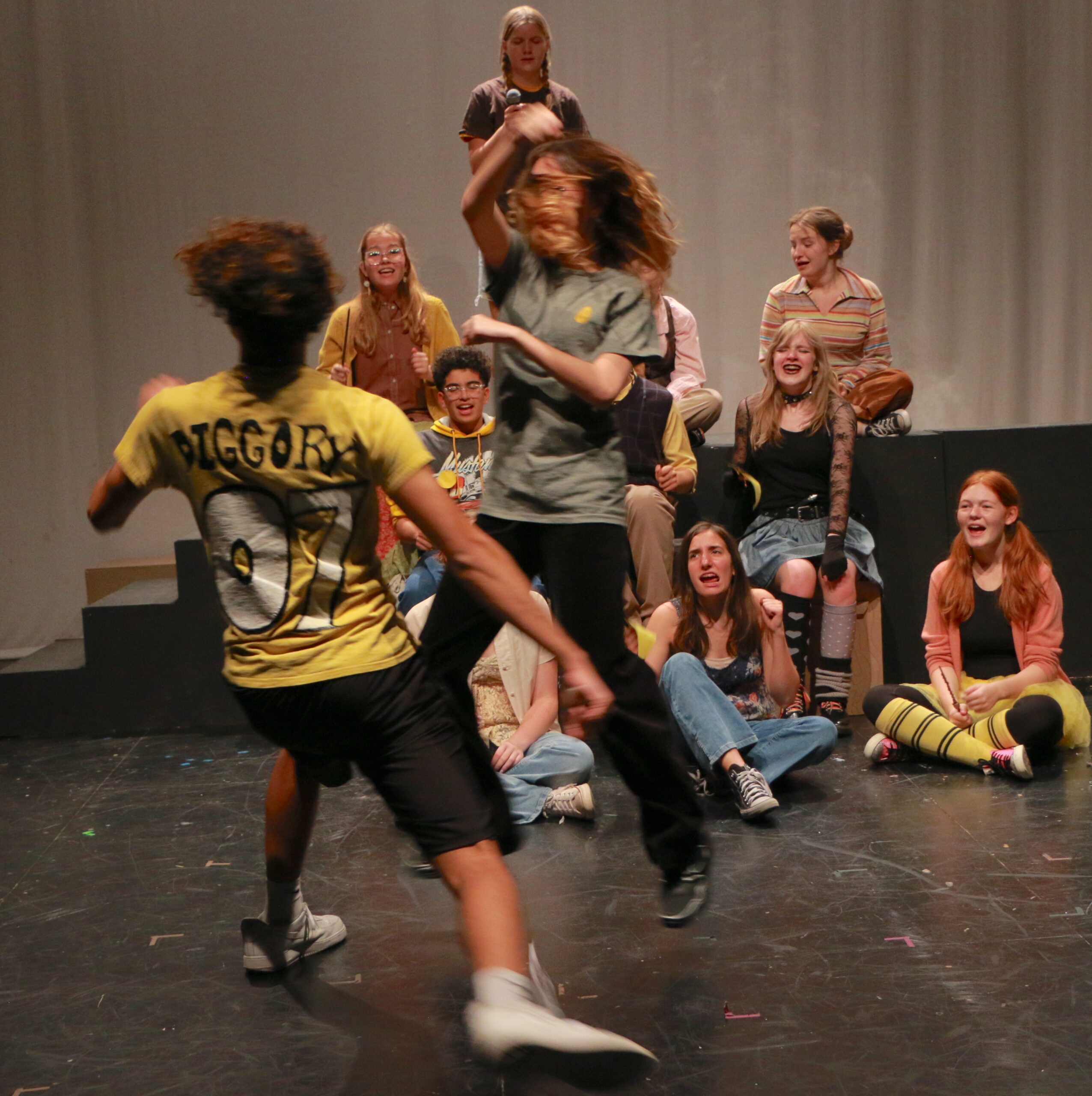 Student actors performing in Puffs