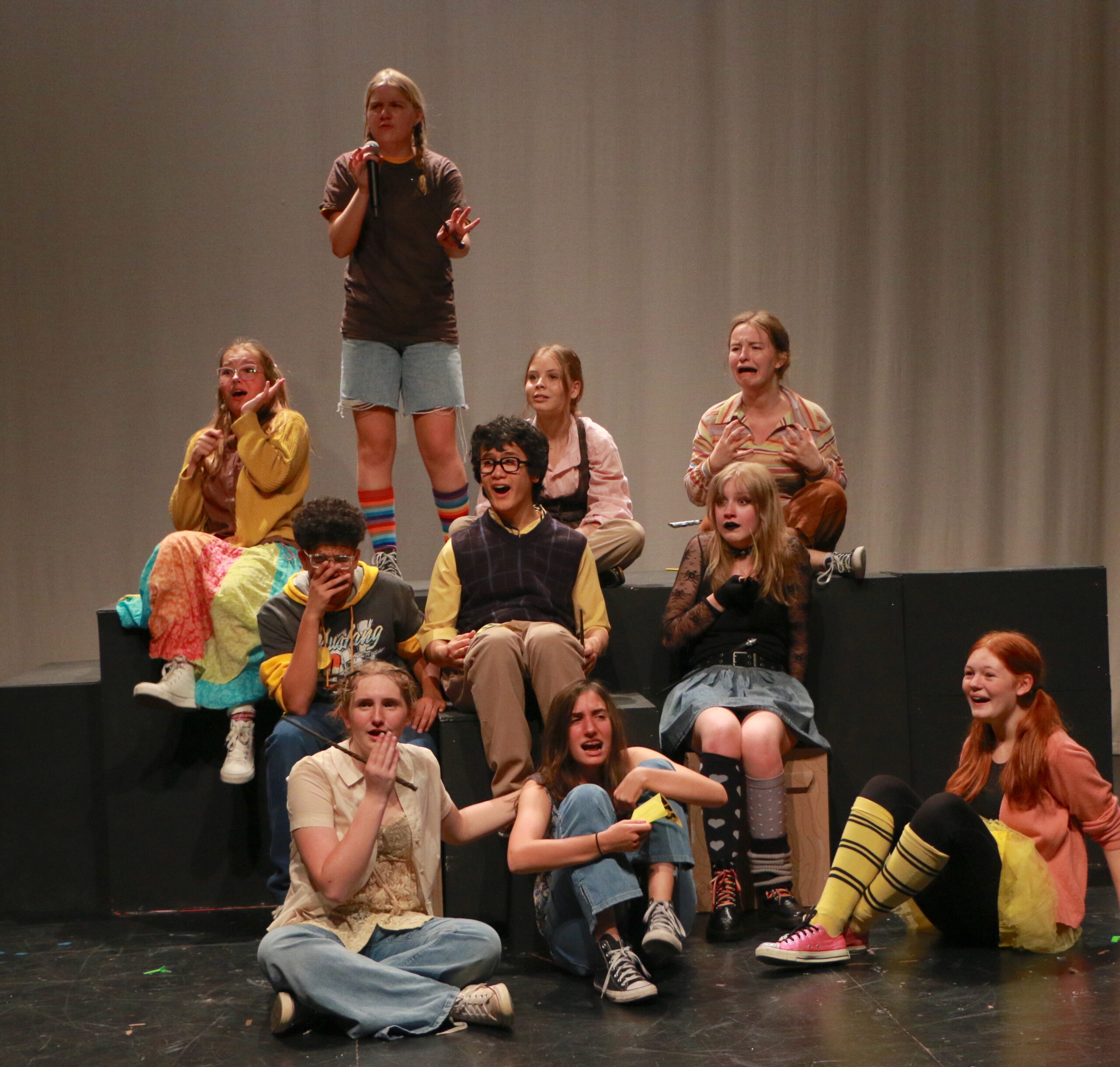 Student actors performing in Puffs