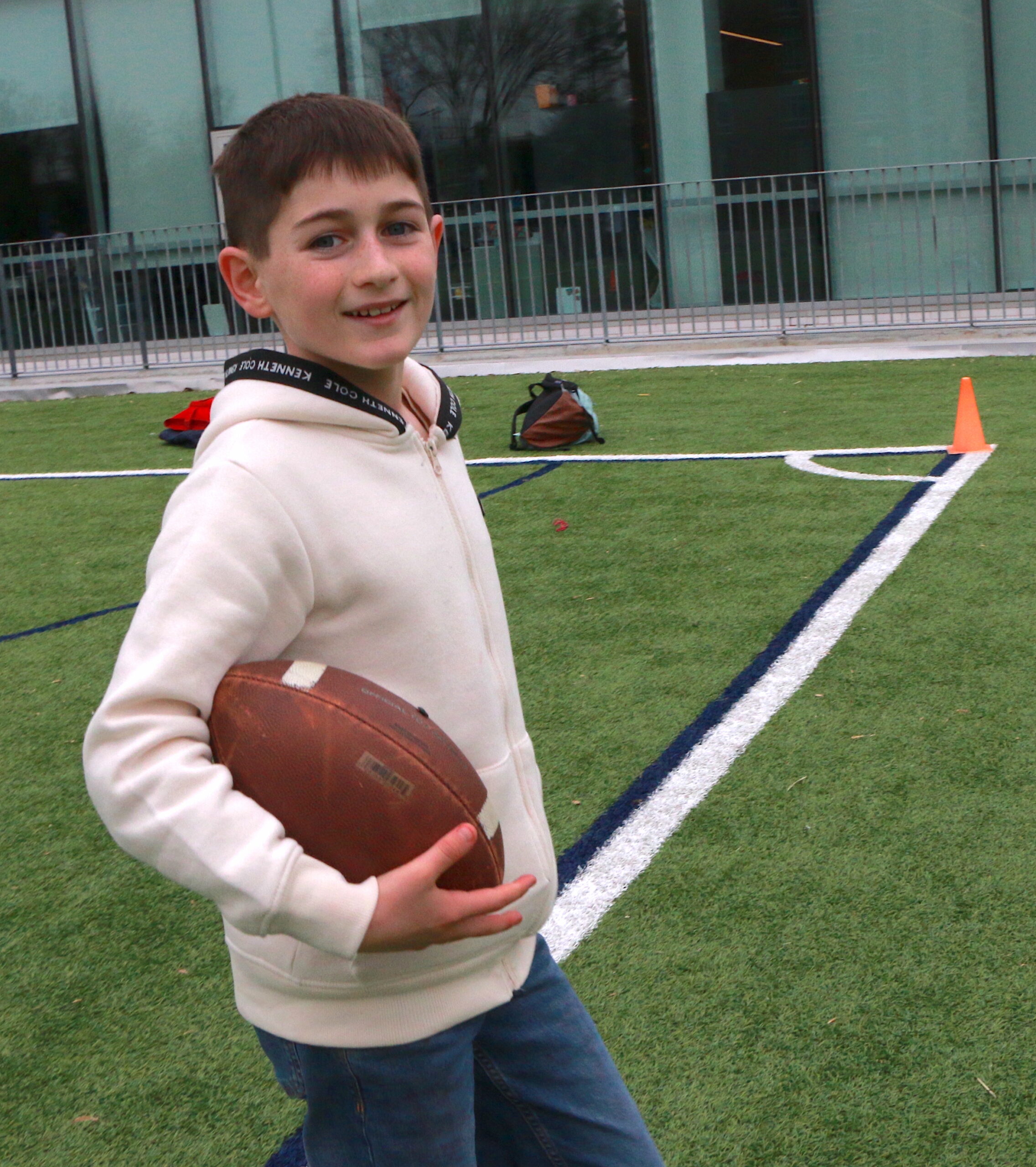 Student carrying football at the Turkey Bowl
